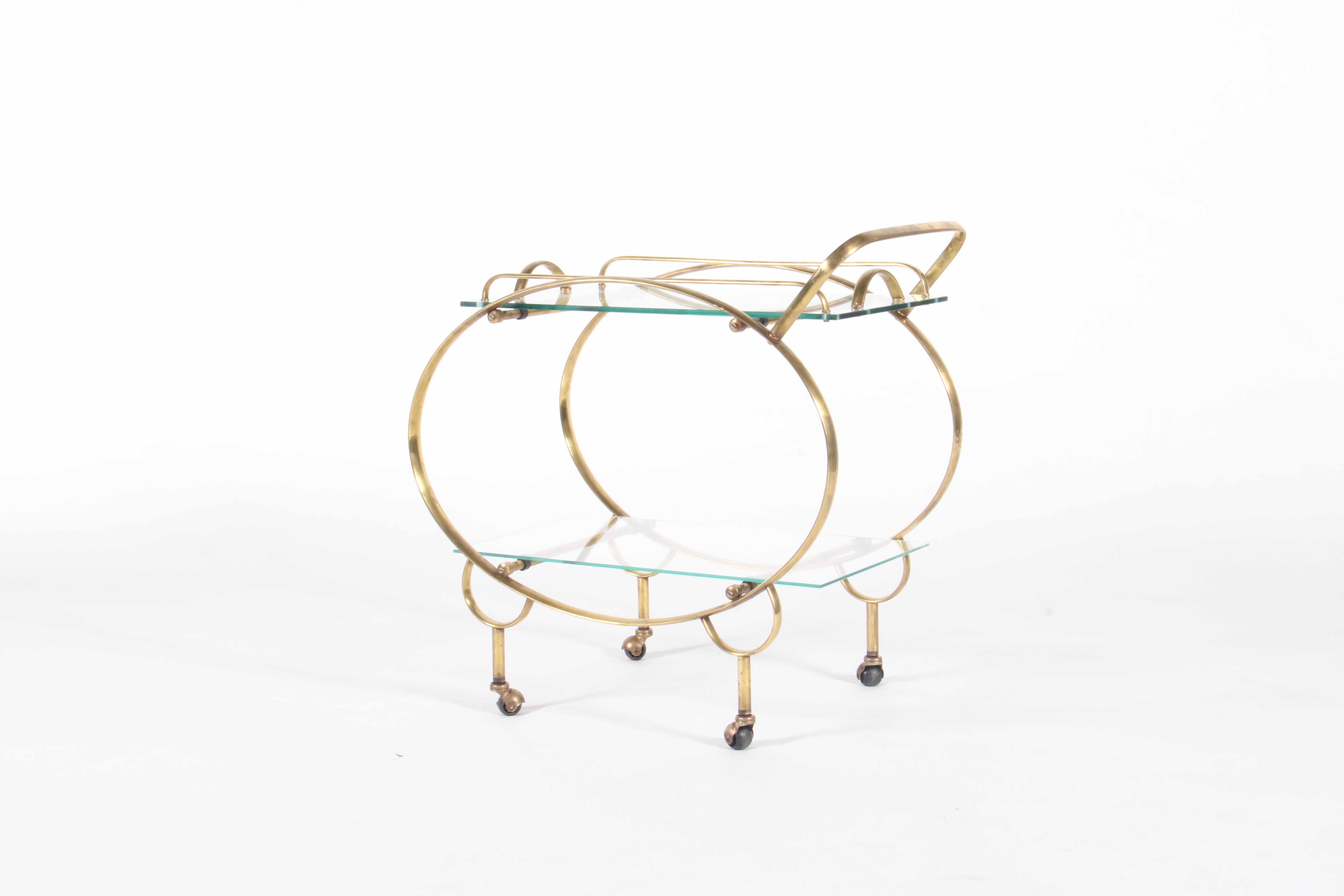 Super stylish mid century Italian drinks trolley in gilt metal with removable serving tray. The perfect piece to add style and a real design impact to your home or interior design project. Aged beautifully this drinks trolley / bar cart has the
