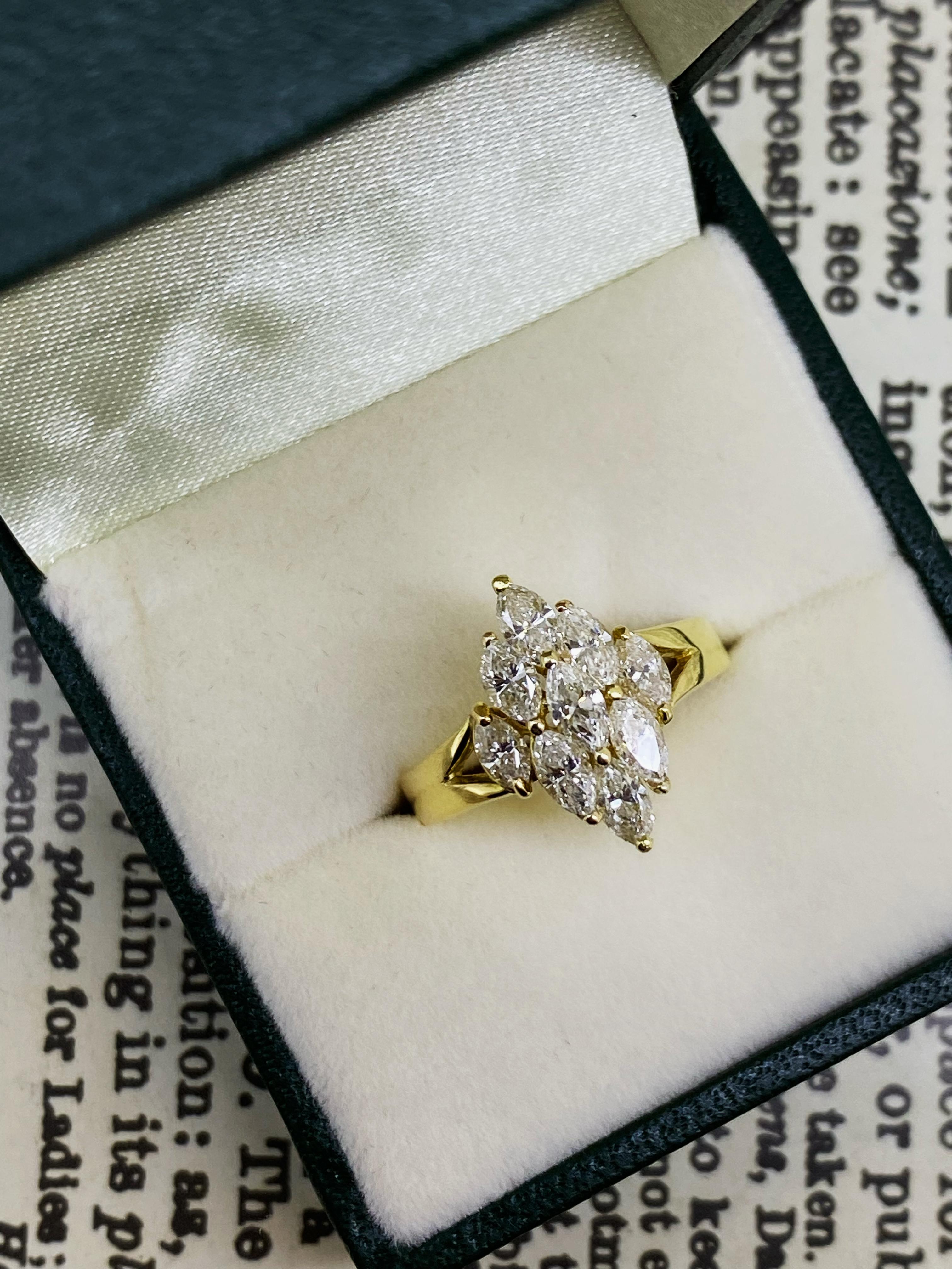 Visually striking & reminiscent of a famous designer, 
this superb ring is crafted in 18K Yellow Gold
with remarkable attention to details:

The ring (so as each diamond) is unusually designed 
as a rhombus / lozenge,
centring a cluster of desirable