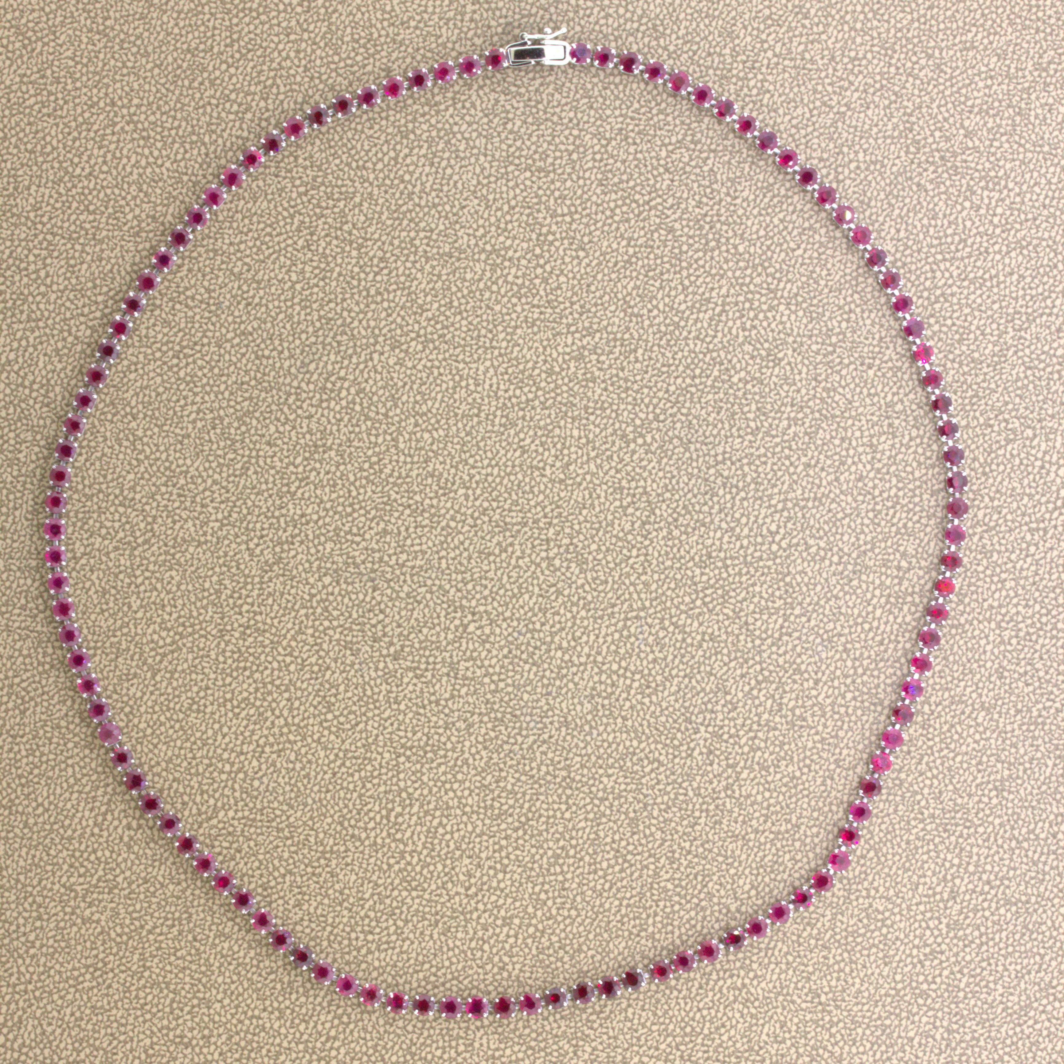 A tennis necklace featuring a straight line of super fine quality rubies. They weigh a total of 15.12 carats and what makes them so special is their color and brilliance. They have bright vivid red color known in the trade as “pigeon blood.” Adding