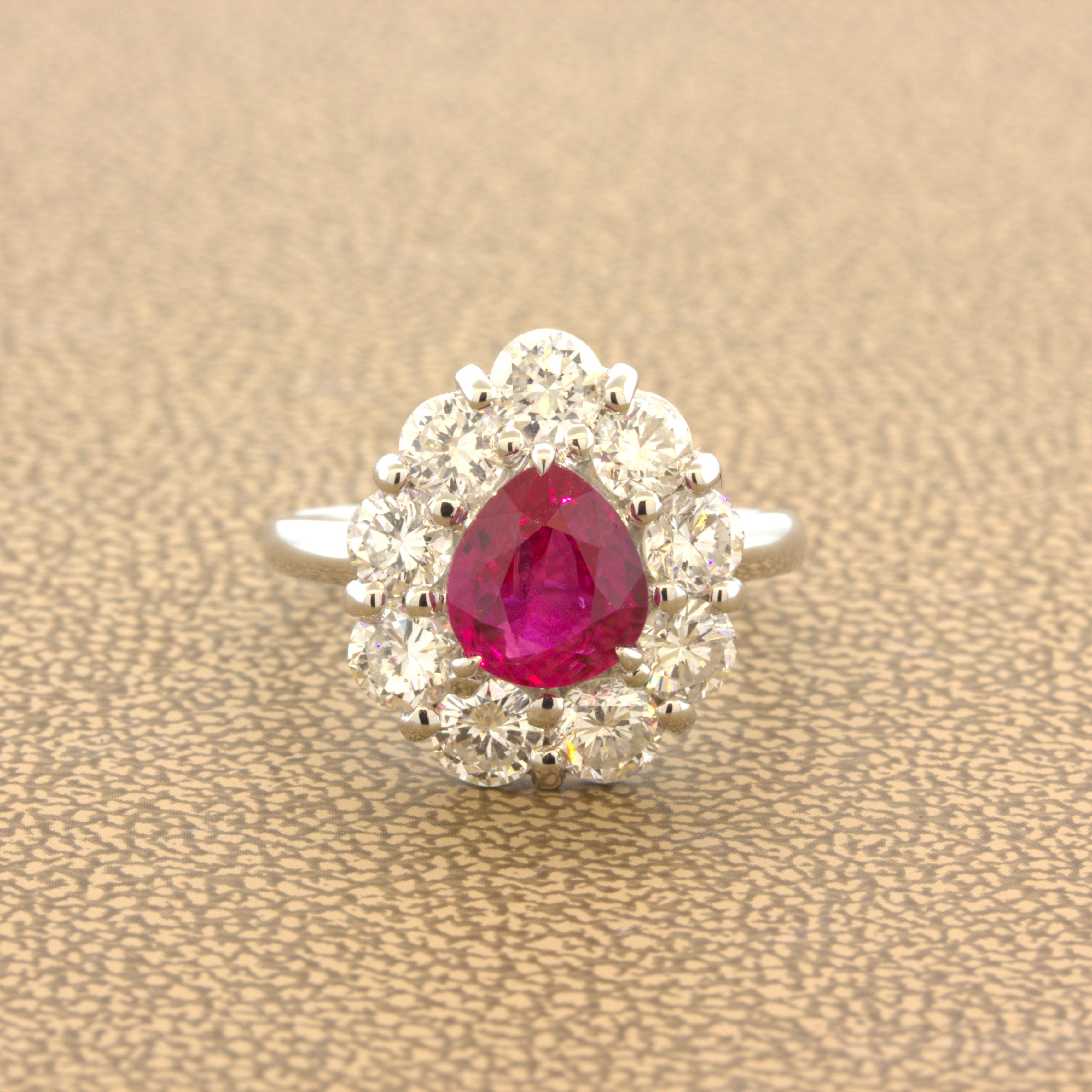 A super gem Burmese ruby takes center stage. It weighs 1.79 carats and has a rich and vibrant vivid pinkish-red color that is full of life and brilliance. The color of the ruby pops with excellent brightness. It is complemented by 1.84 carats of