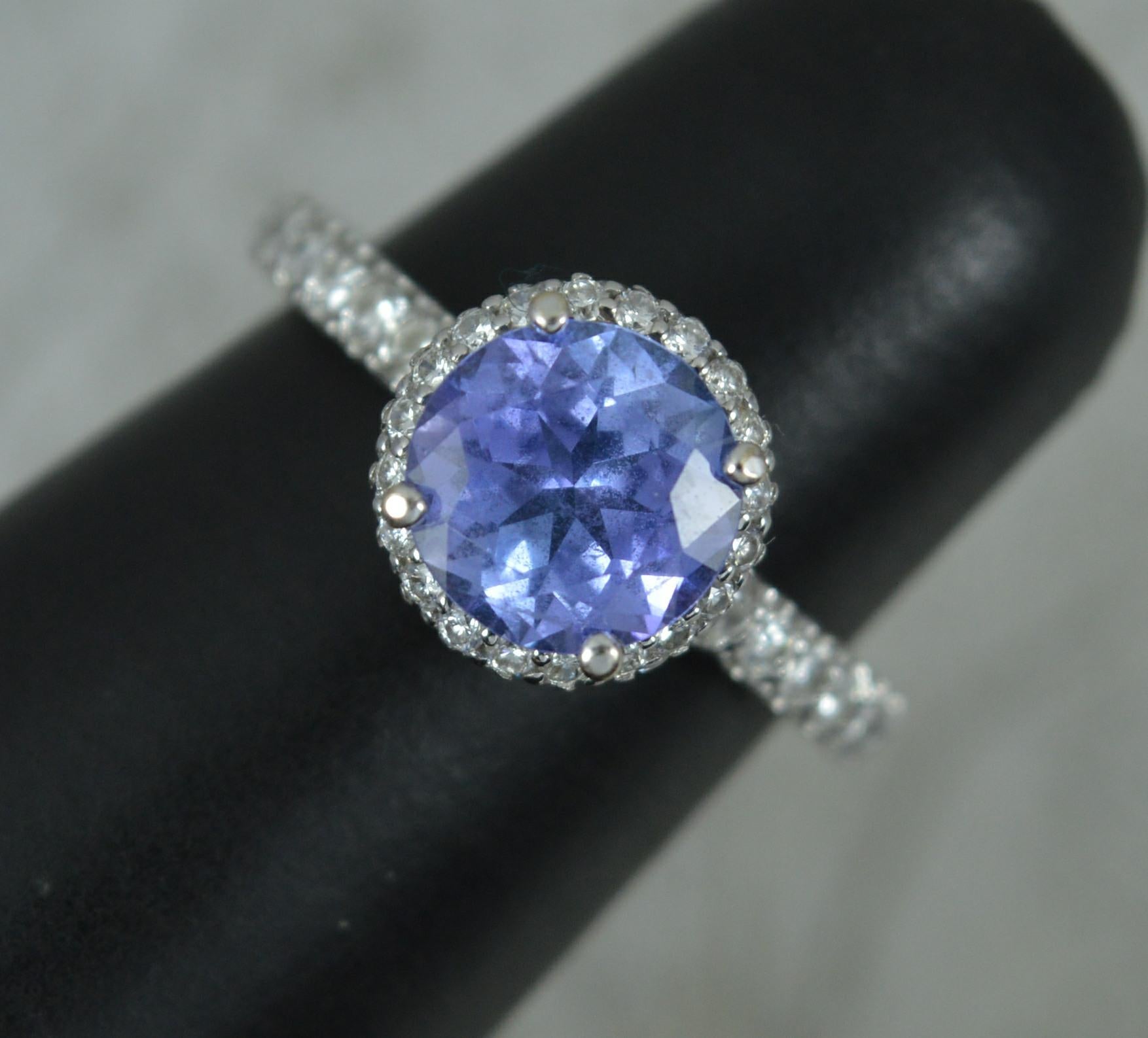 Superb 18ct White Gold Tanzanite and 0.75ct Diamond Halo Engagement Ring For Sale 4