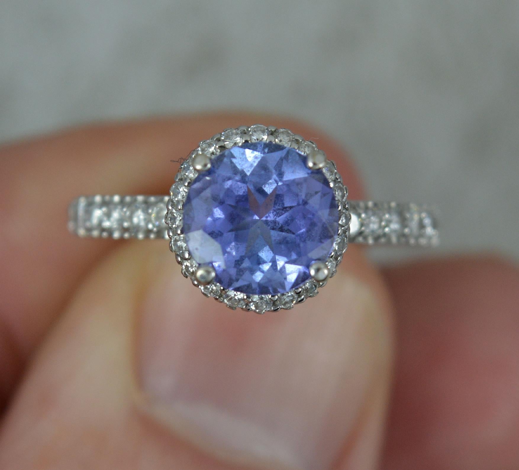 Superb 18ct White Gold Tanzanite and 0.75ct Diamond Halo Engagement Ring In Excellent Condition For Sale In St Helens, GB