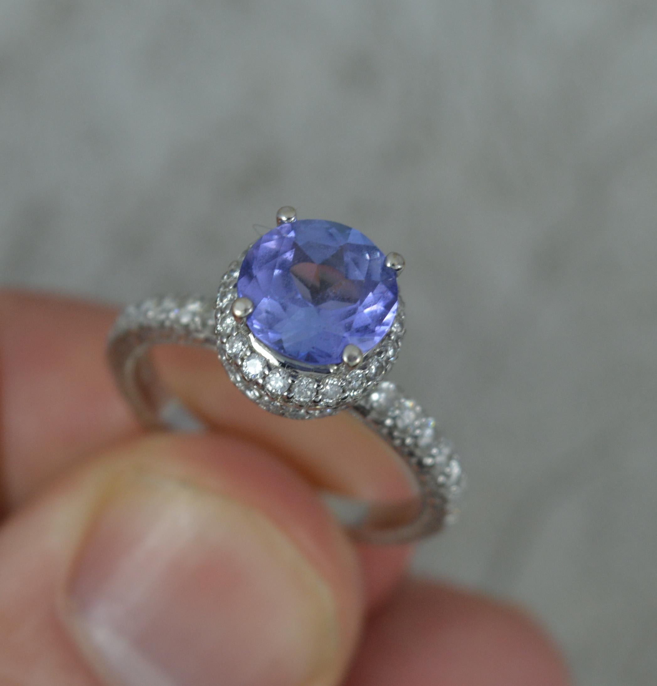 Women's Superb 18ct White Gold Tanzanite and 0.75ct Diamond Halo Engagement Ring For Sale
