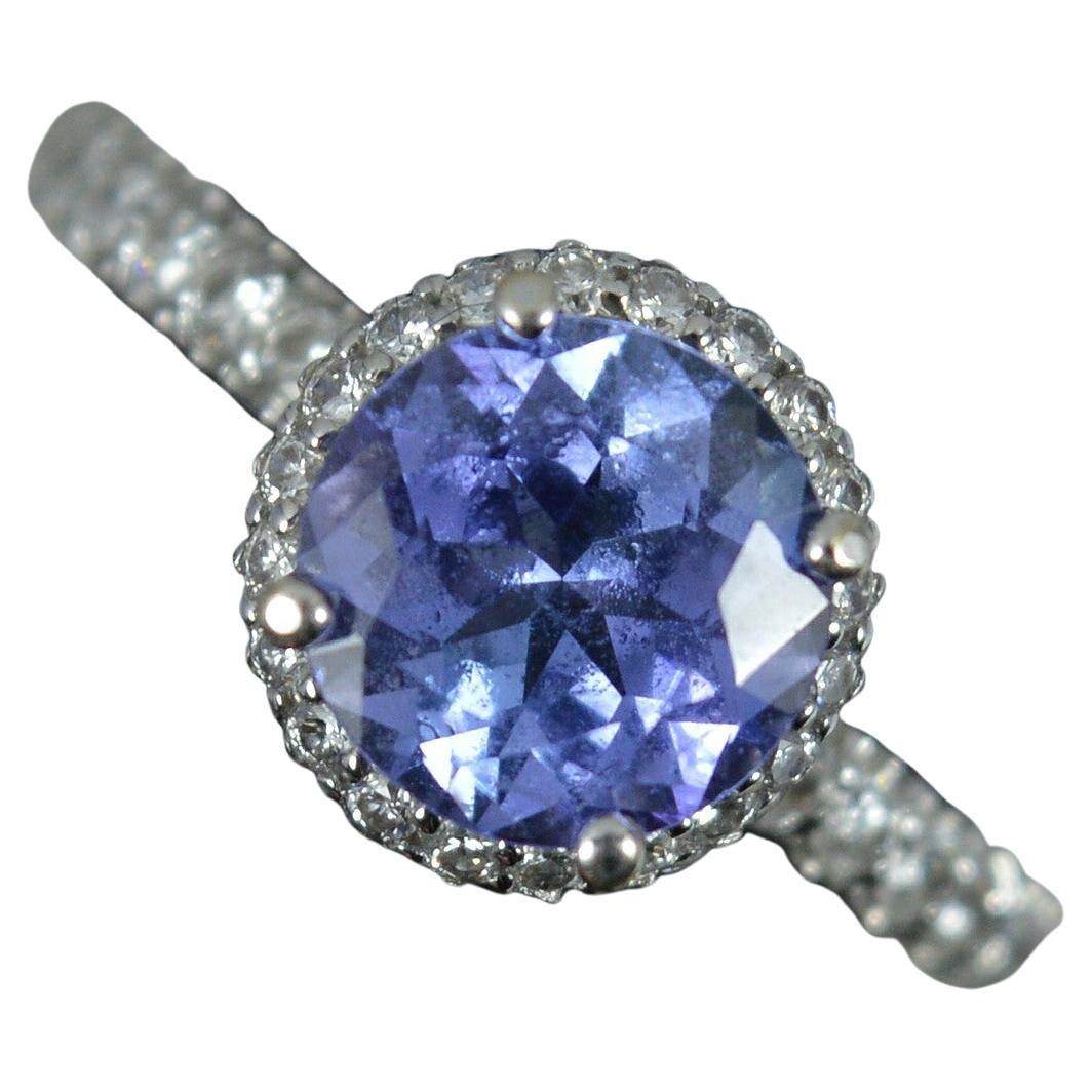 Superbe bague de fiançailles en or blanc 18 carats, tanzanite et halo de diamants 0,75 carat