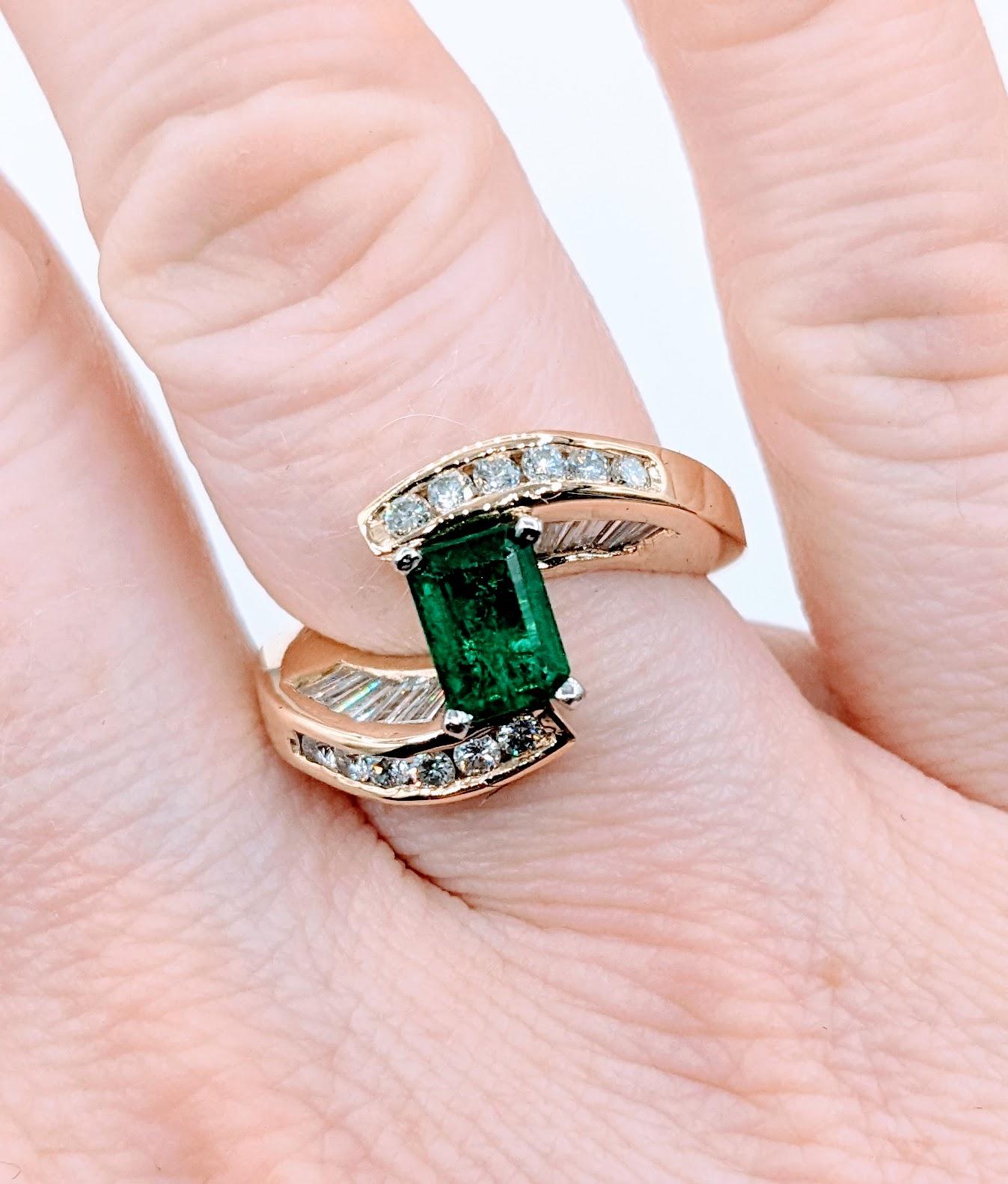 Superb 18k Emerald and Diamond Bypass Ring

Indulge in the luxurious beauty of this exquisite ring, crafted from 18k yellow gold and featuring 1.50ctw of dazzling round and baguette diamonds. The sparkling diamonds boast VS2 clarity and G color,