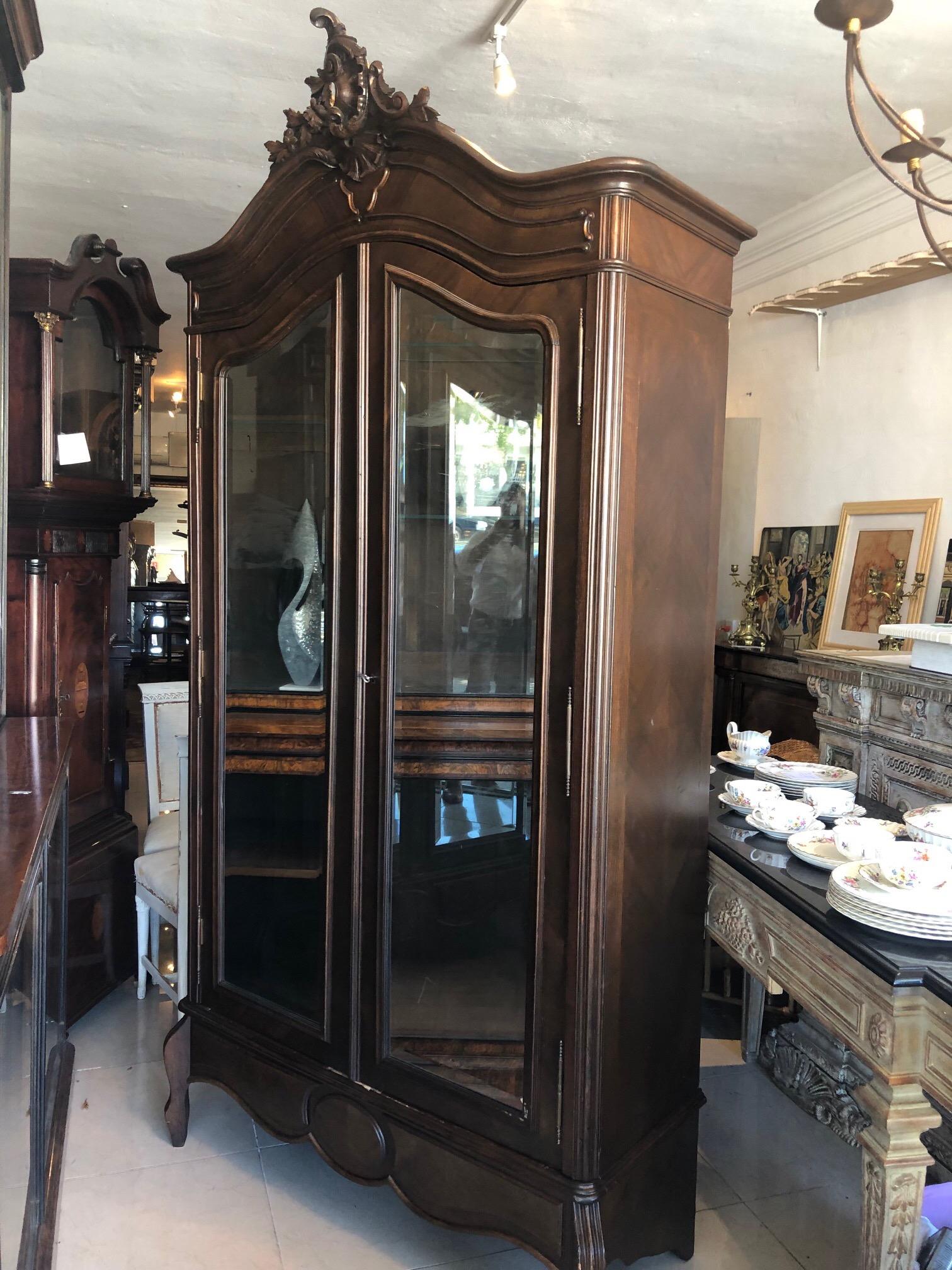 This is a very nice antique French armoire in excellent condition, it may have been refinished at some time.
There are two mirrored doors very nice carving to the top in the Rocco style.
This comes apart so its easy to move.
Just one little age