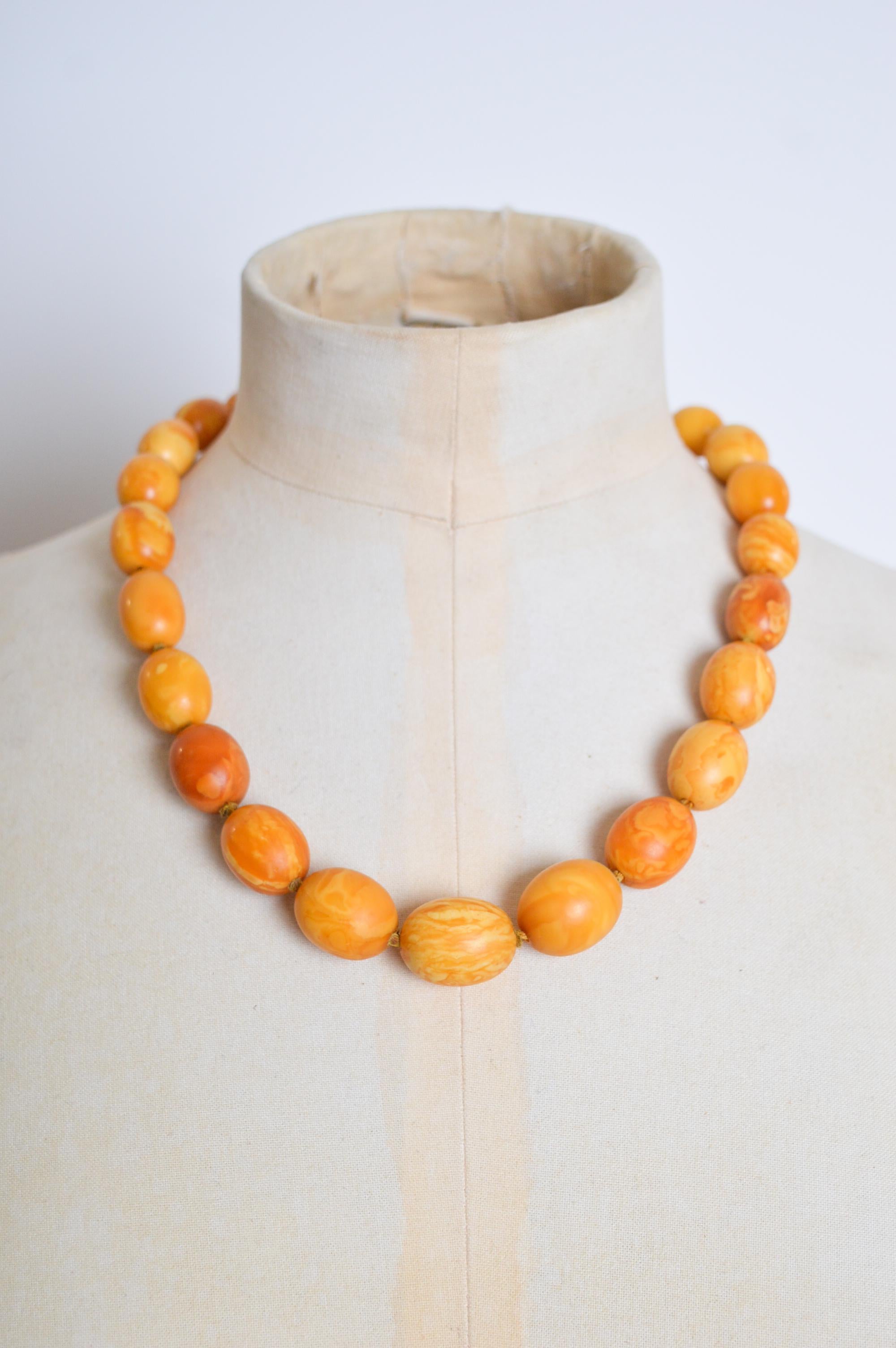 A Truly exceptional Antique Amber Necklace, circa 1930.

Graduated olive shaped beads, crafted from beautiful butterscotch Amber, with a 9ct Gold clasp. 

Length; 50cm
Widest Bead; 22mm > Smallest Bead 14mm
Weight; 49.09g

If you have any questions