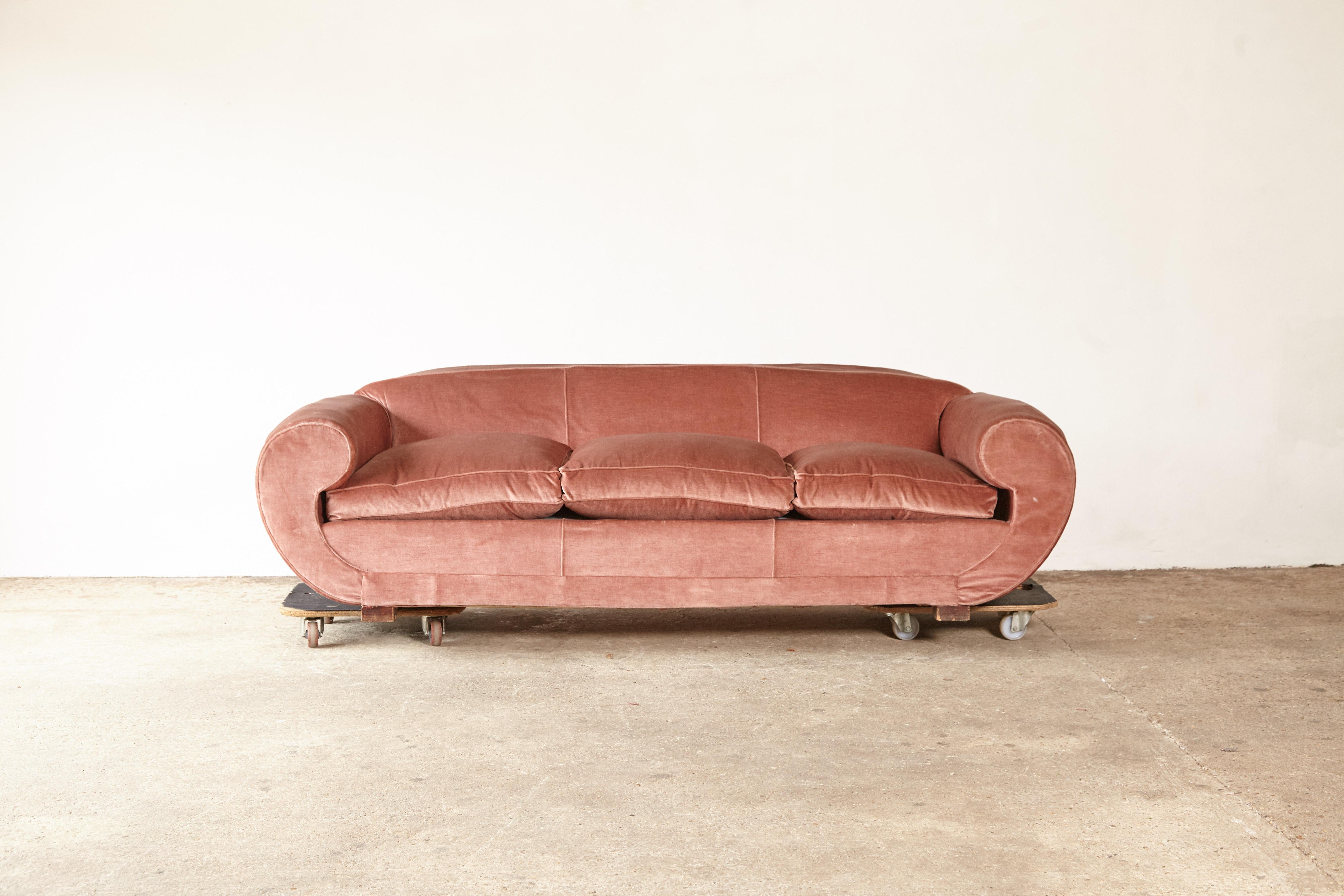 A superb, unique 1950s pink sofa attributed to Maison Gouffe, France, 1940s-1950s.  The fabric shows some signs of wear and small areas of minor damage.  

Price inclusive of UK tax

       