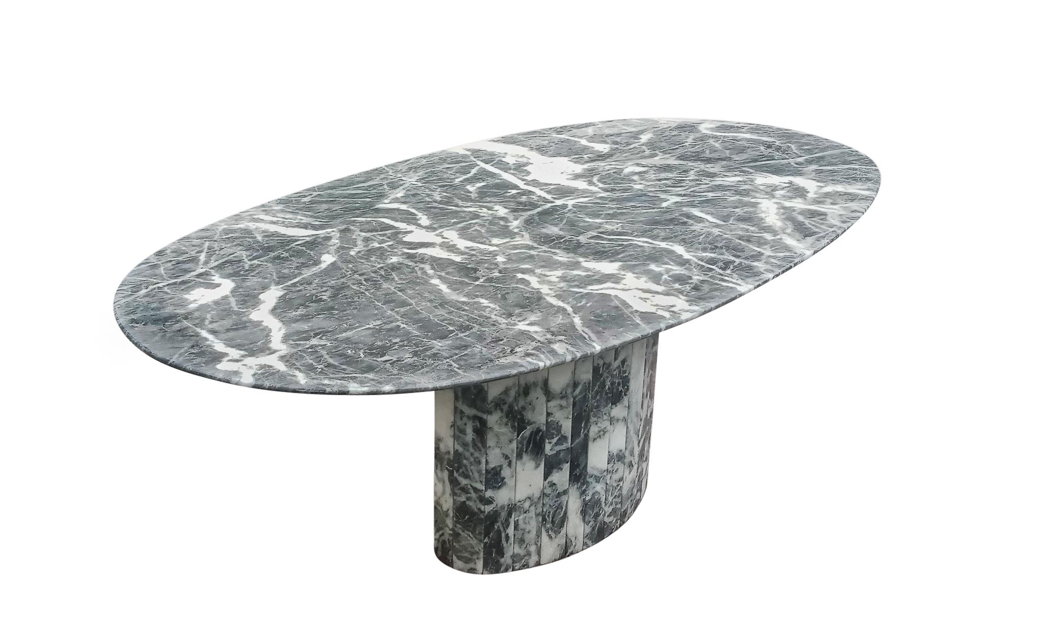 Beautiful and practical! Large vintage exotic breccia marble dining table, designed and manufactured in Italy. This table has a strong formal design with rich veining in white, in a mostly grey field, which is indictive of the highest quality of