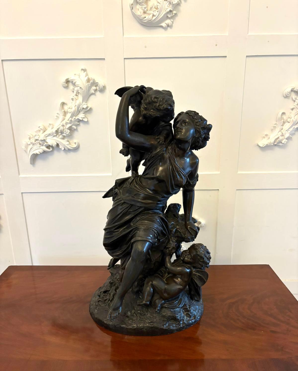 Superb 19th century bronze sculpture by Auguste Moreau depicting a classical female figure surrounded by playful cherubs. The woman draped in flowing robes looks upward with a joyful expression as one cherub perches upon her shoulder and another