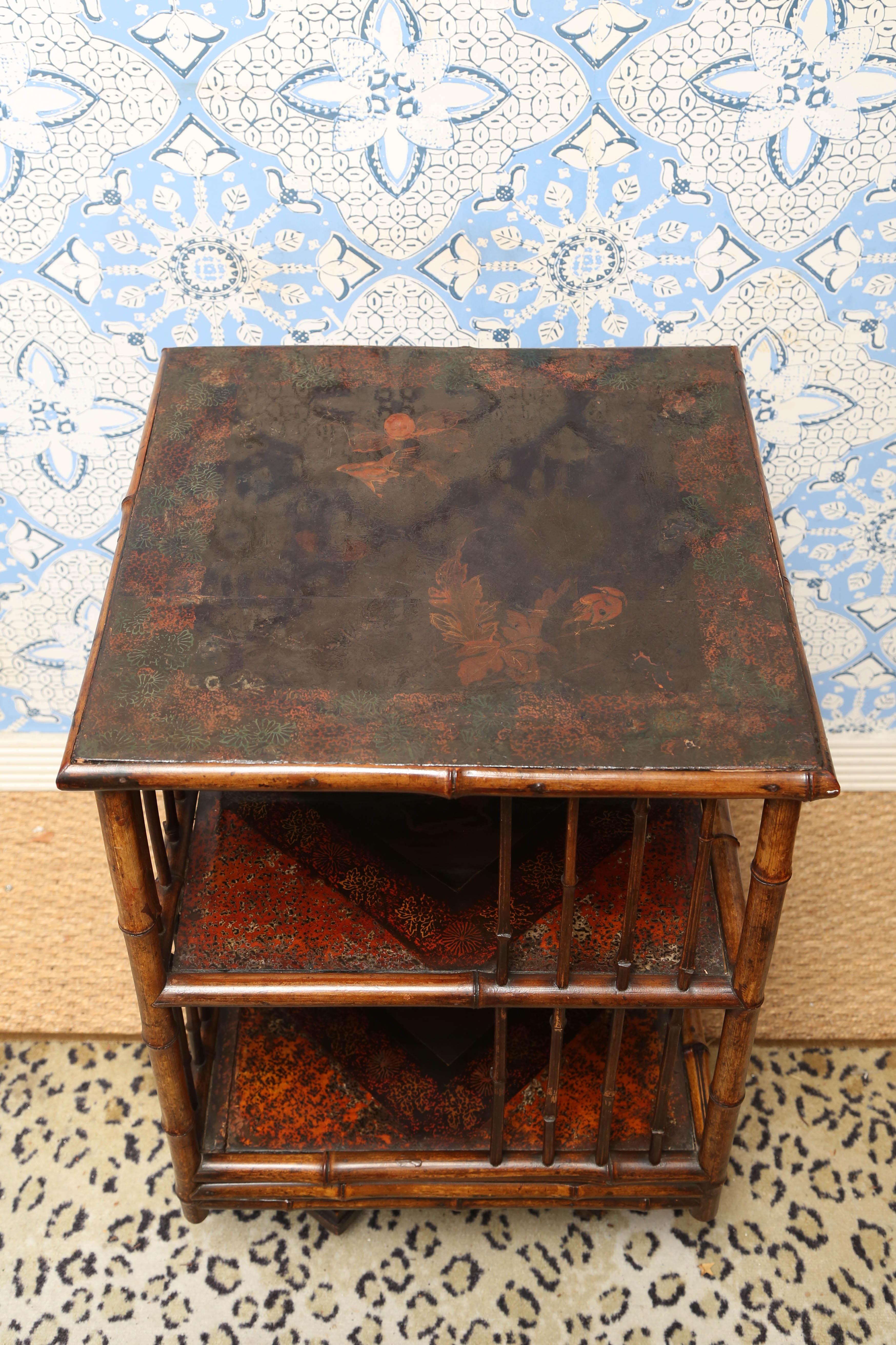 Superb 19th century English bamboo turning table on wheels for books or displays with Japanning.