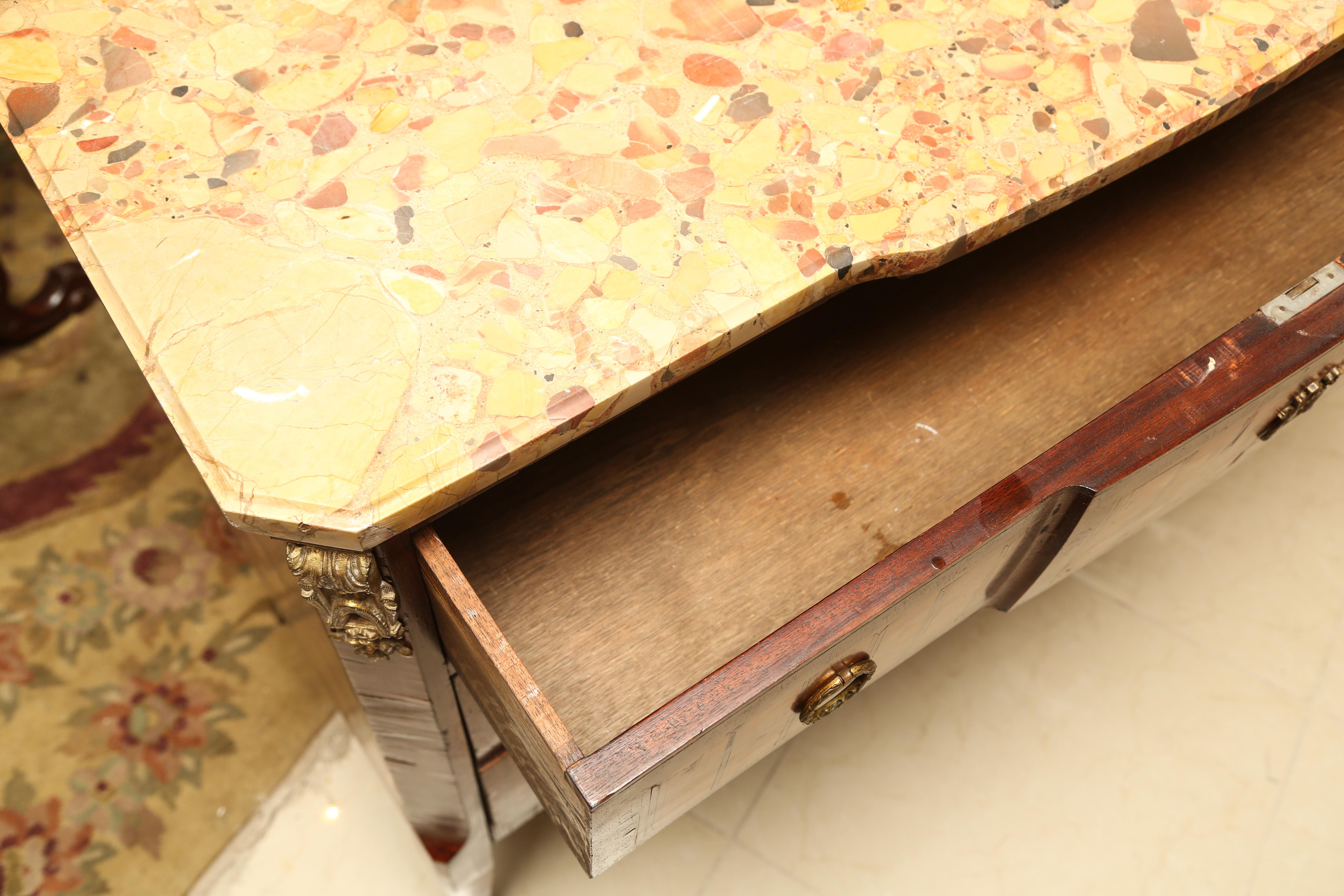 This is a very nice antique marble top French commode with ormolu mounts to the sides and bottom.
It also has inlay to the sides and front.
The drawer linings are sold wood with dovetail joints
Made in France, circa 1890.
The top has a