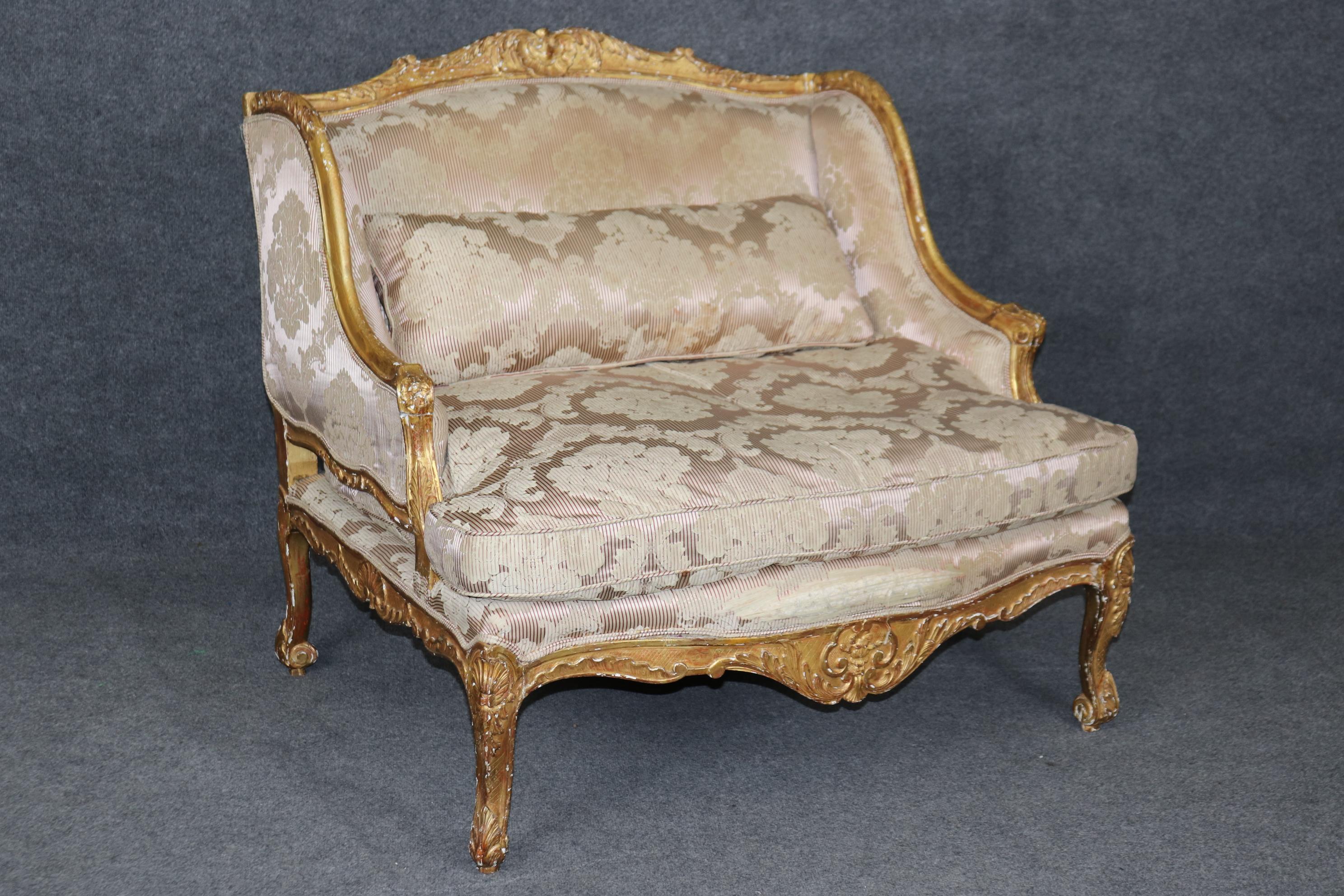Ok, this is a superb frame, the frame is expertly carved and gilded in bright gold leaf that's genuine gold. The frame is substantially wider than a typical bergere chair and the finish has its beautiful finish and signs of age including chips,
