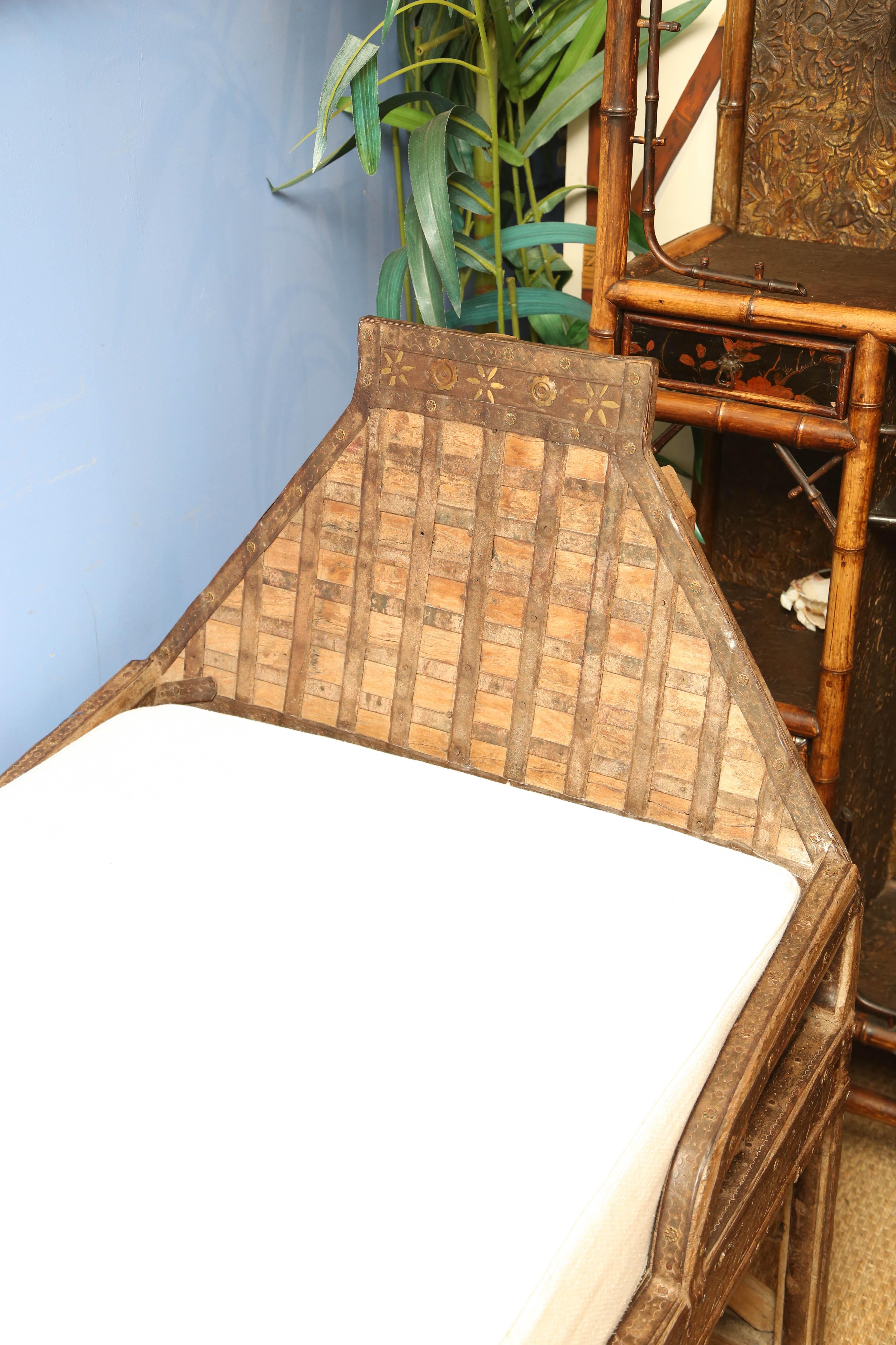 An 19th century Indian iron mounted bed with wood and a firm mattress. Very comfortable! The day bed is 27 inches high with the mattress and 21 inches without it.