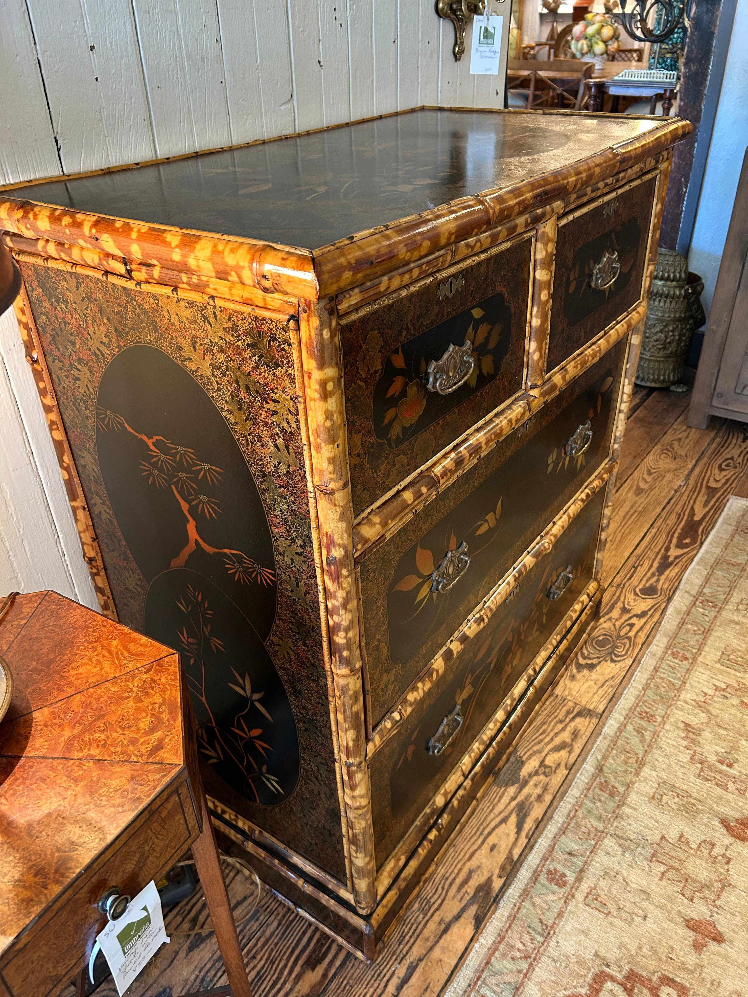 Gorgeous black lacquer and split bamboo chest of drawers from the 19th century having 2 roomy lower drawers with 2 side by side smaller drawers above.  Original brass hardware and escutcheons (no key).  The chest is beautifully decorated with