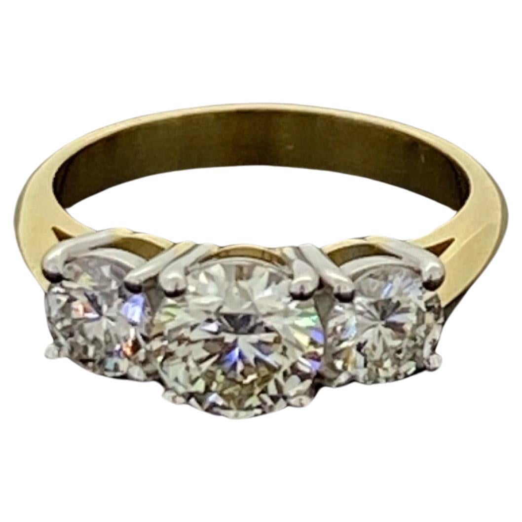 Round Cut Superb 2.05ct 3-Stone Diamond Ring in 18K Gold. Center stone: 1.05ct, Ideal Cut. For Sale