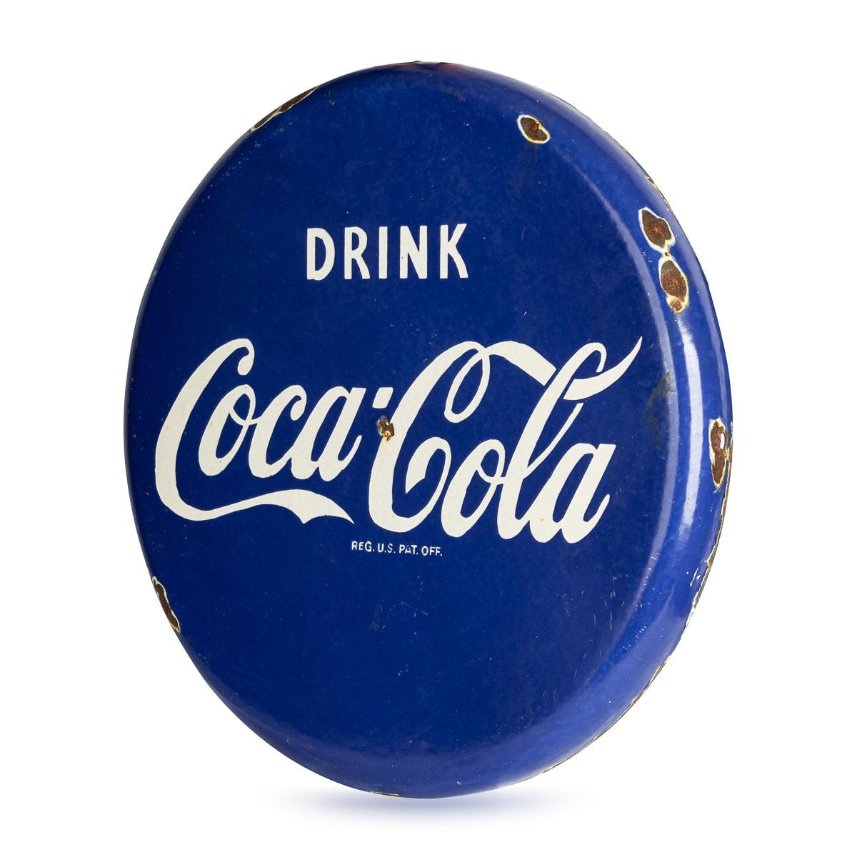 A splendid mid 20th Century blue Coca-Cola enamel advertising sign.

CONDITION
In Great Condition - Wear expected with age. Please refer to photographs. 

SIZE
Diameter: 47 cm // 18.50 in
Depth: 4 cm // 1.57 in

