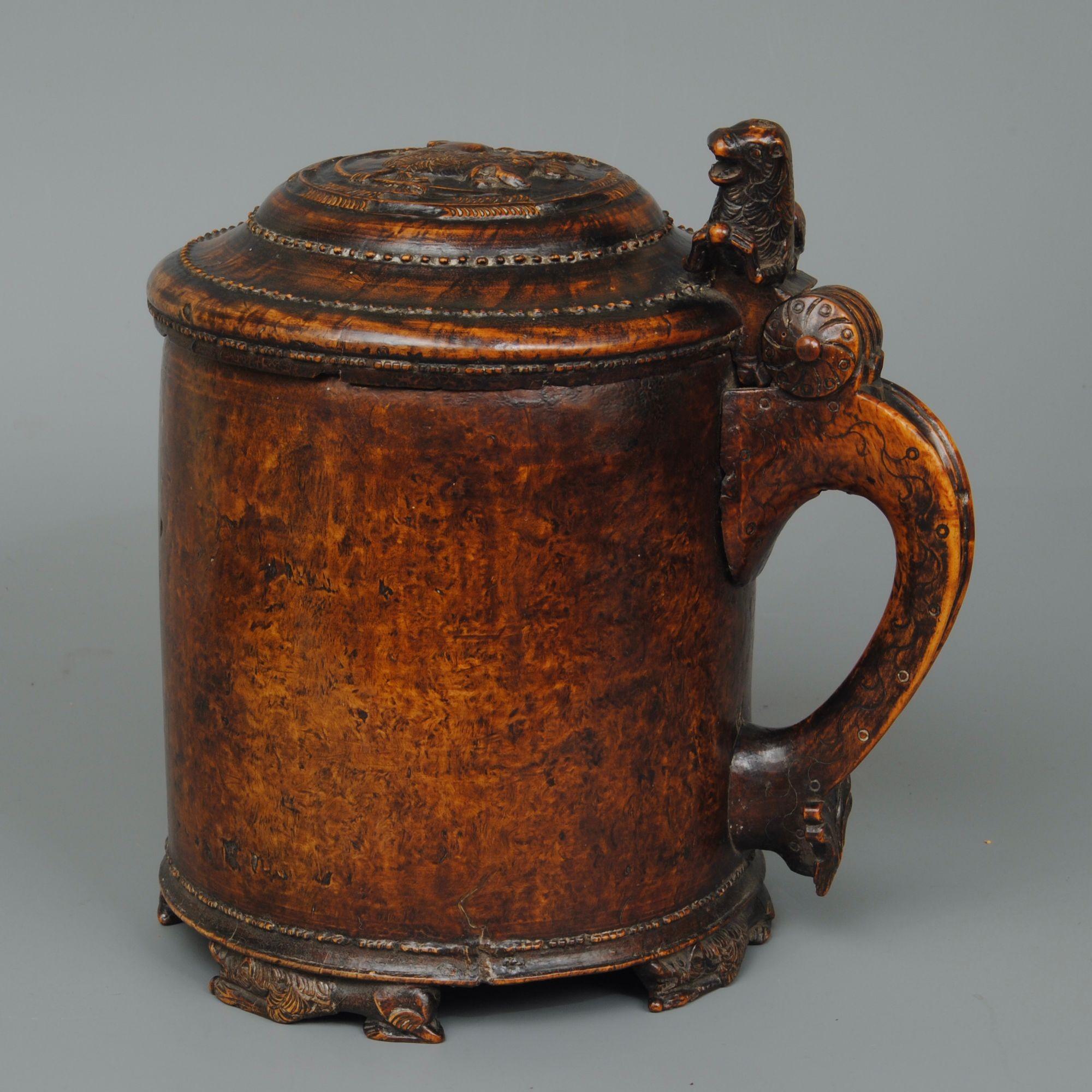 A fine and large 18th century Norwegian burr wood peg tankard with carved Lions on the feet, lid and knob, wonderful colour and patination. Circa 1765.
 

 