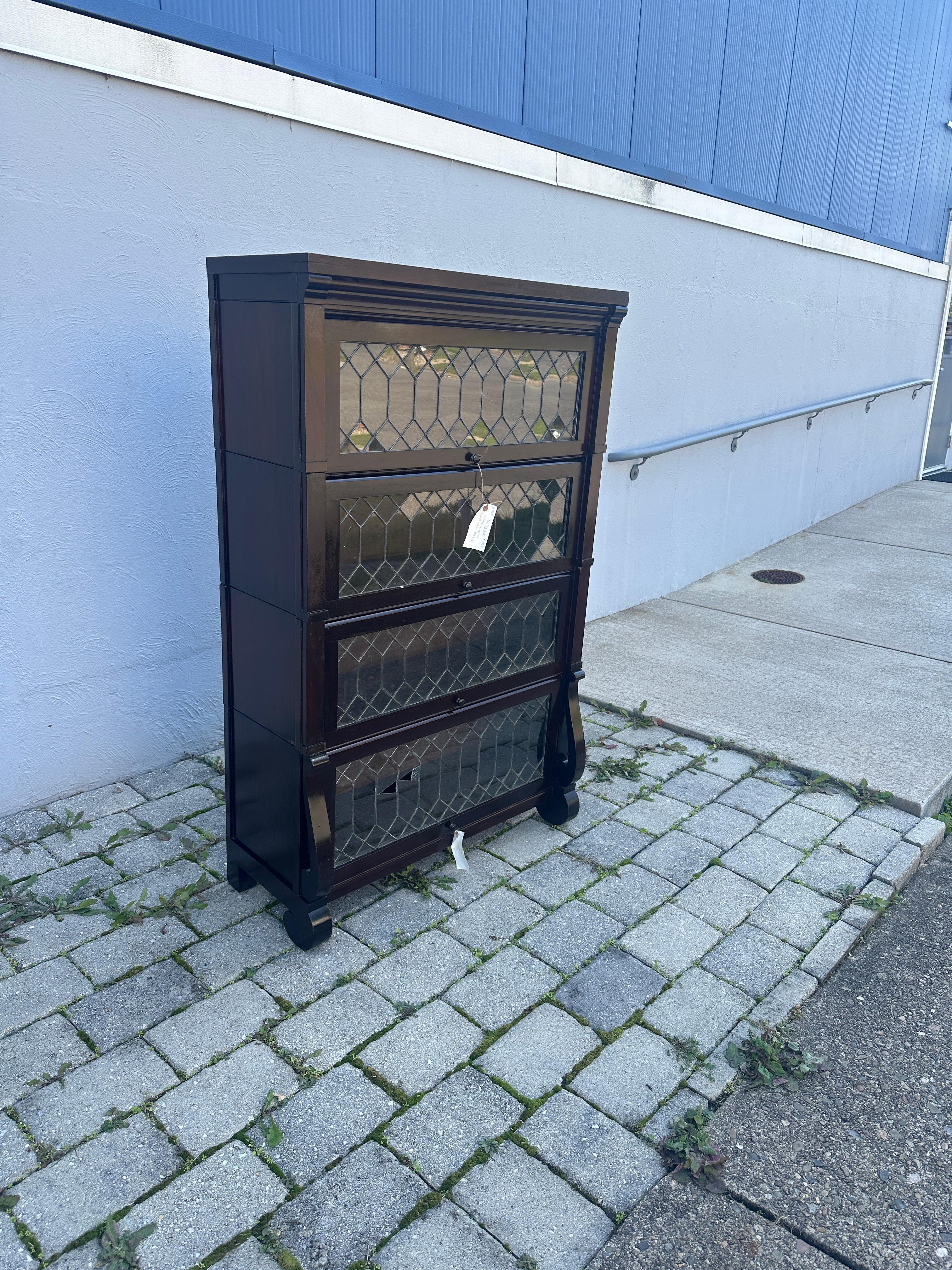 This is a very nice set of barrister bookcases from the early 1900s in very good condition.  Made by the Grand Rapids Furniture Company (see photo of original seal) with great leaded glass doors.  Very good condition, including the glass.  Looks