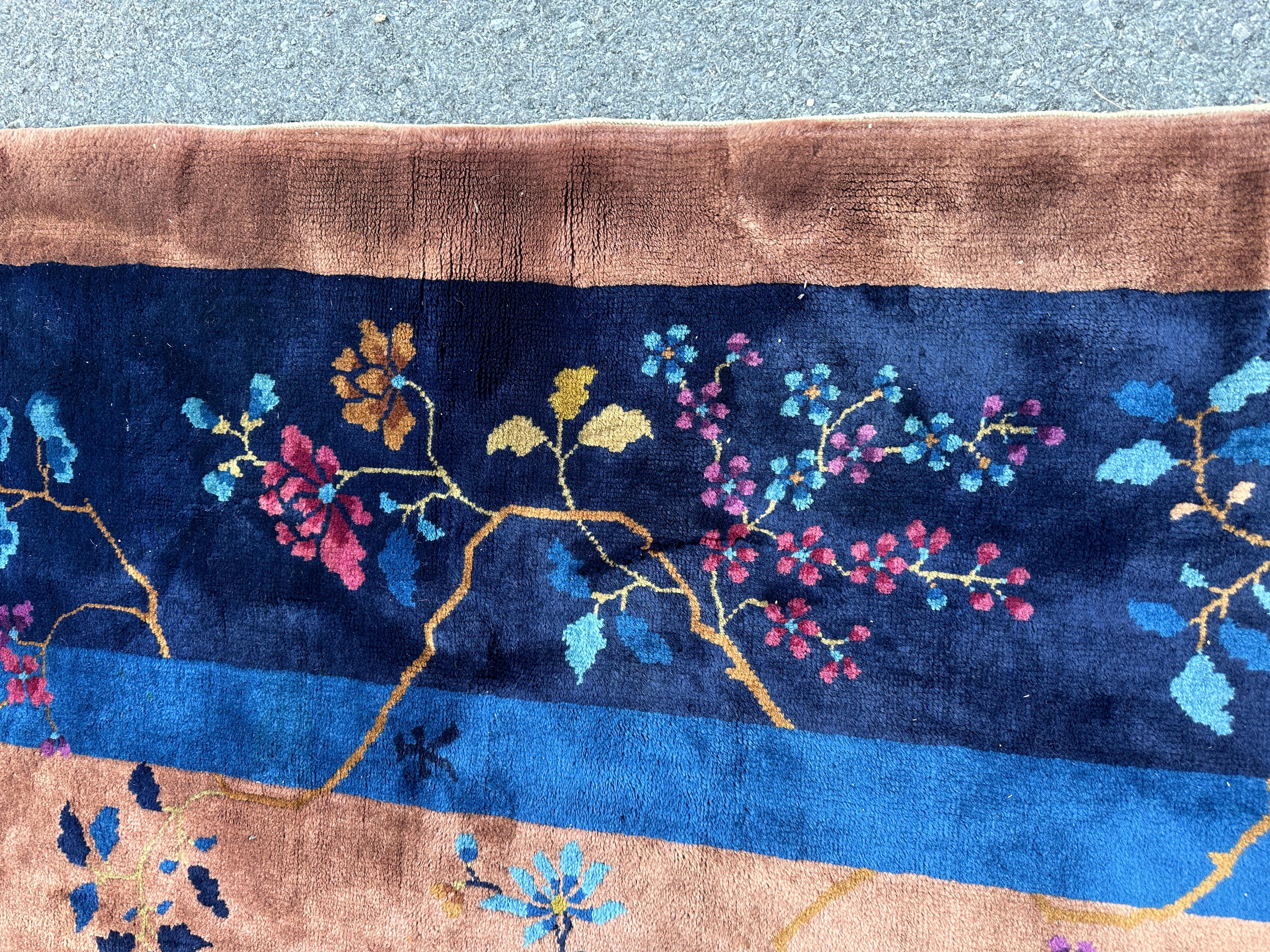 This is a superb antique Chinese Art Deco Rug from the 1930s.  It is in pristine condition with full pile and no wear. Made from Manchester Wool, it is complete with nothing missing. This unusually beautiful rug is shampooed and ready for use in