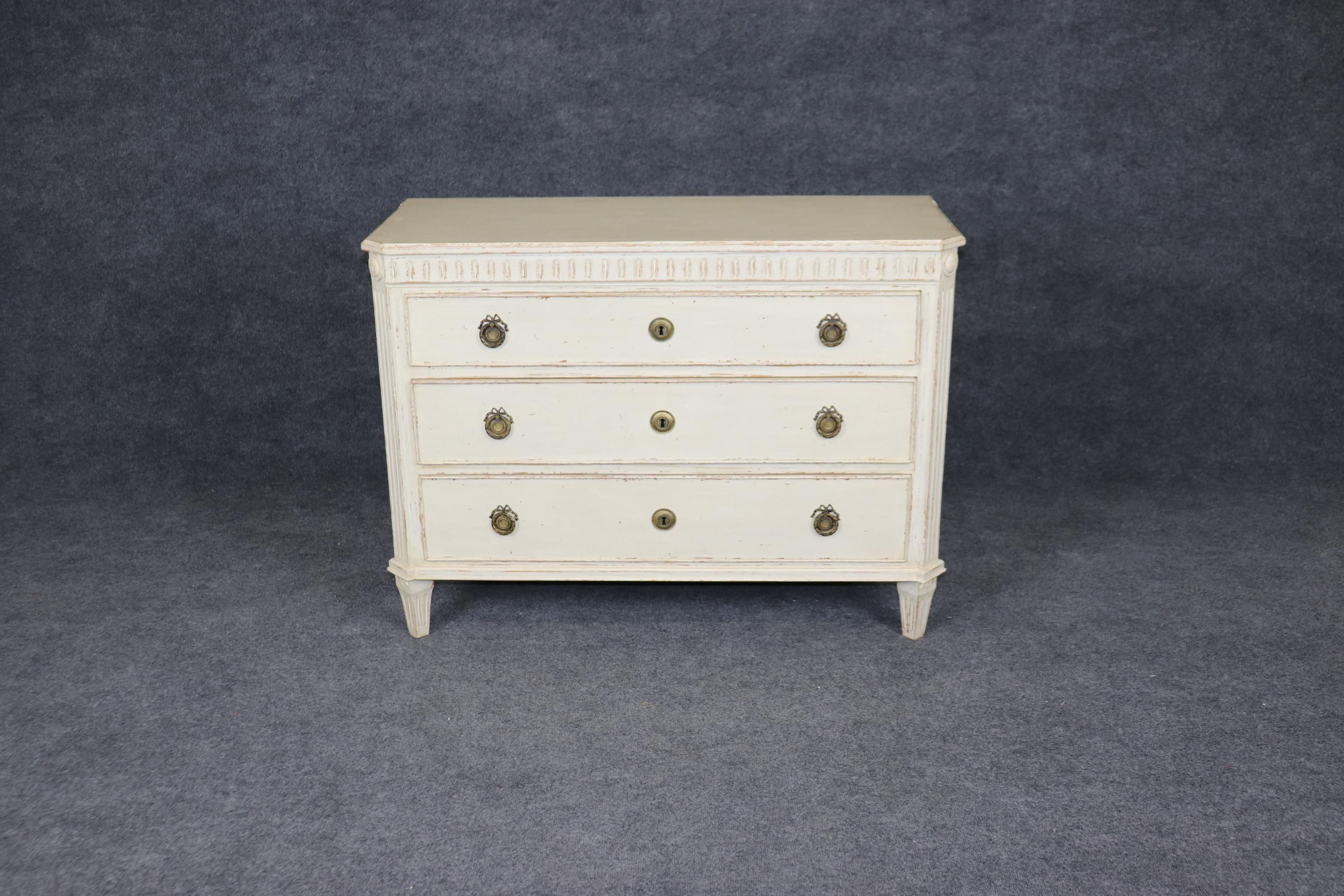 This is a gorgeous antique distressed painted Gustavian or Swedish commode. At first glance it appears French Louis XVI or Directoire, but it's actually Swedish in the Gustavian manner. King Gustav 