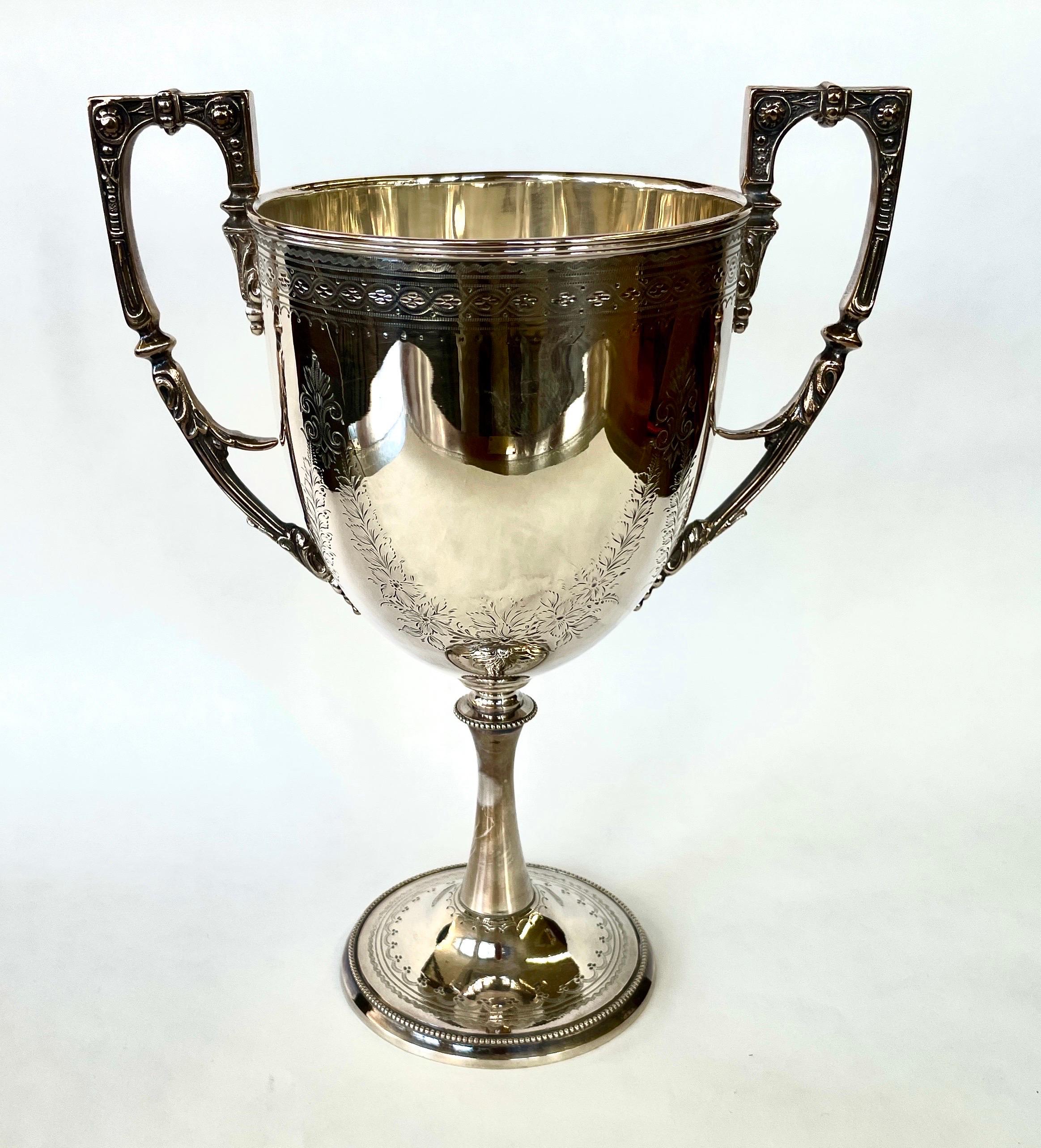 This is a fantastic large, Antique English Sheffield Silver Plate Two-Handle Adam style Loving Cup or Trophy Cup (UNinscrbied) with superb 