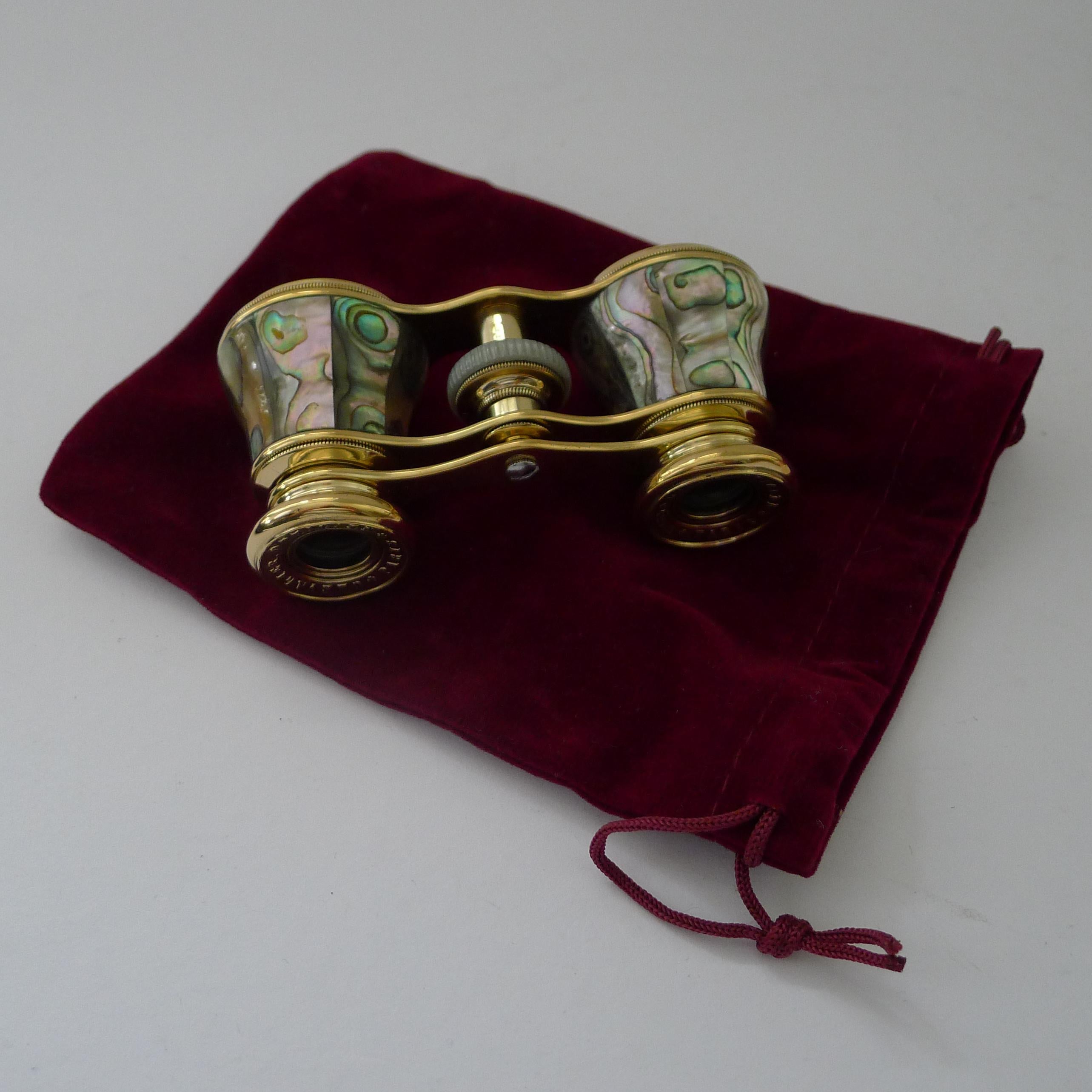 A truly exquisite pair of Opera Glasses by the well renowned French maker, Chevalier of Paris, signed on both eye pieces.

The glasses are made from polished brass and Abalone shell with it's rich colour and iridescent qualities. The optics are