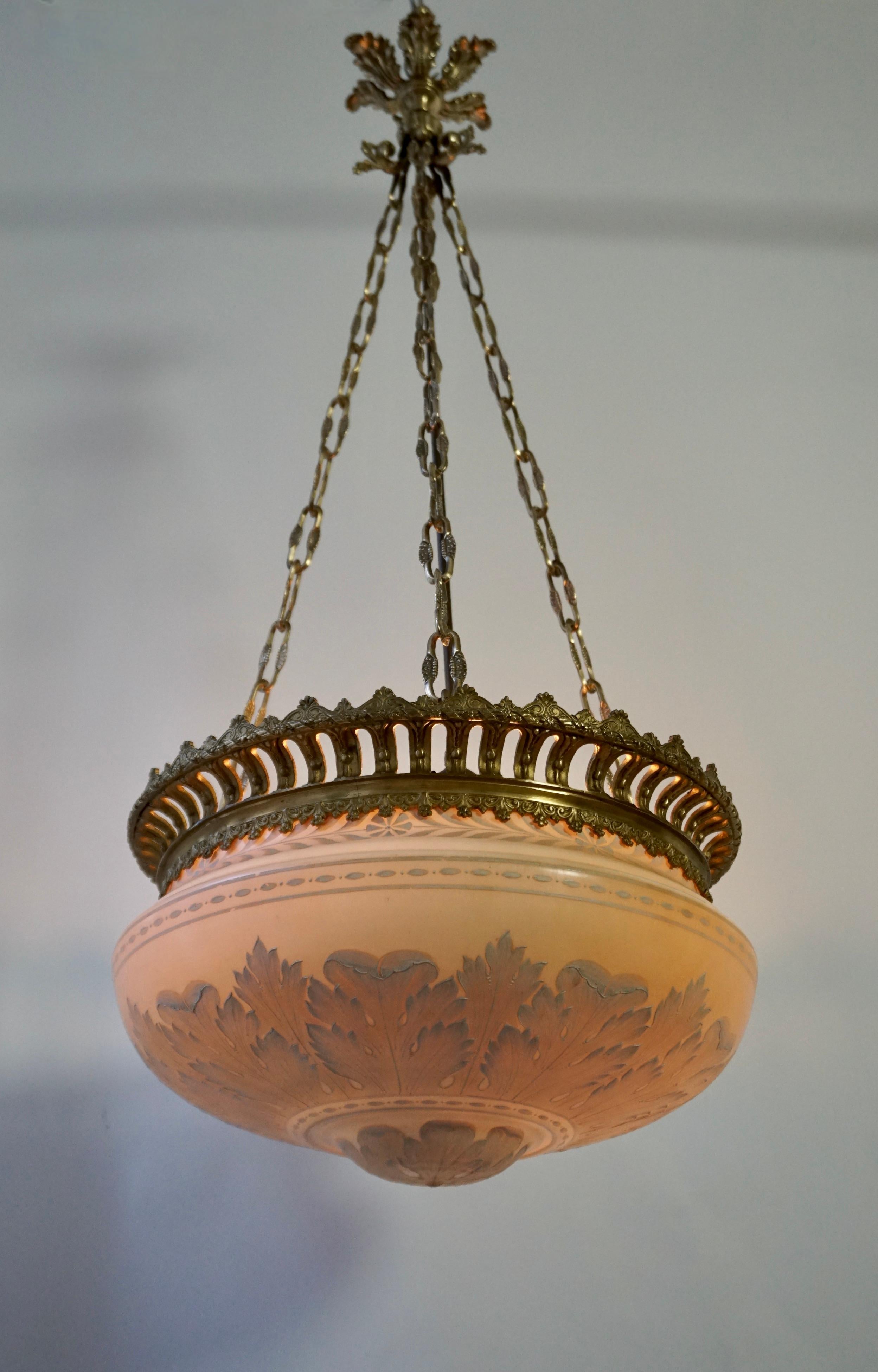 A beautiful rare antique art nouveau chandelier in biscuit and bronze gilt.

The beautiful biscuit bowl is painted with elegant white leaves and hangs in a bronze gilded frame.This biscuit coupe can also be used as flush mount.

Diameter 18.5