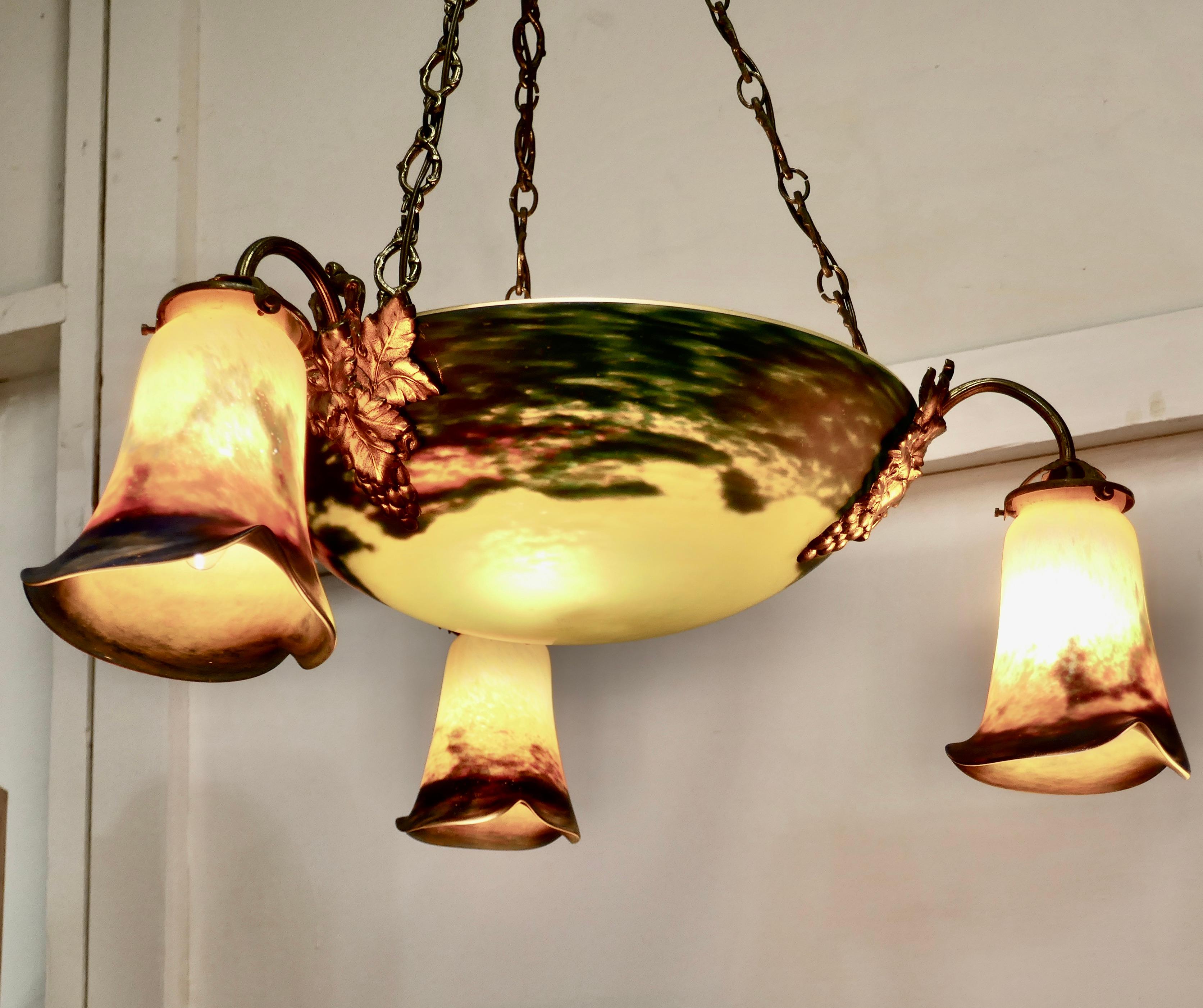 Superb Art Deco painted glass 3-branch centre light

A very unusual and brightly colored piece, the lamp has a large main bowl in the center and 3 branches with decorative ormolu mounts
The glass is decorated in bright color mainly Yellow, it