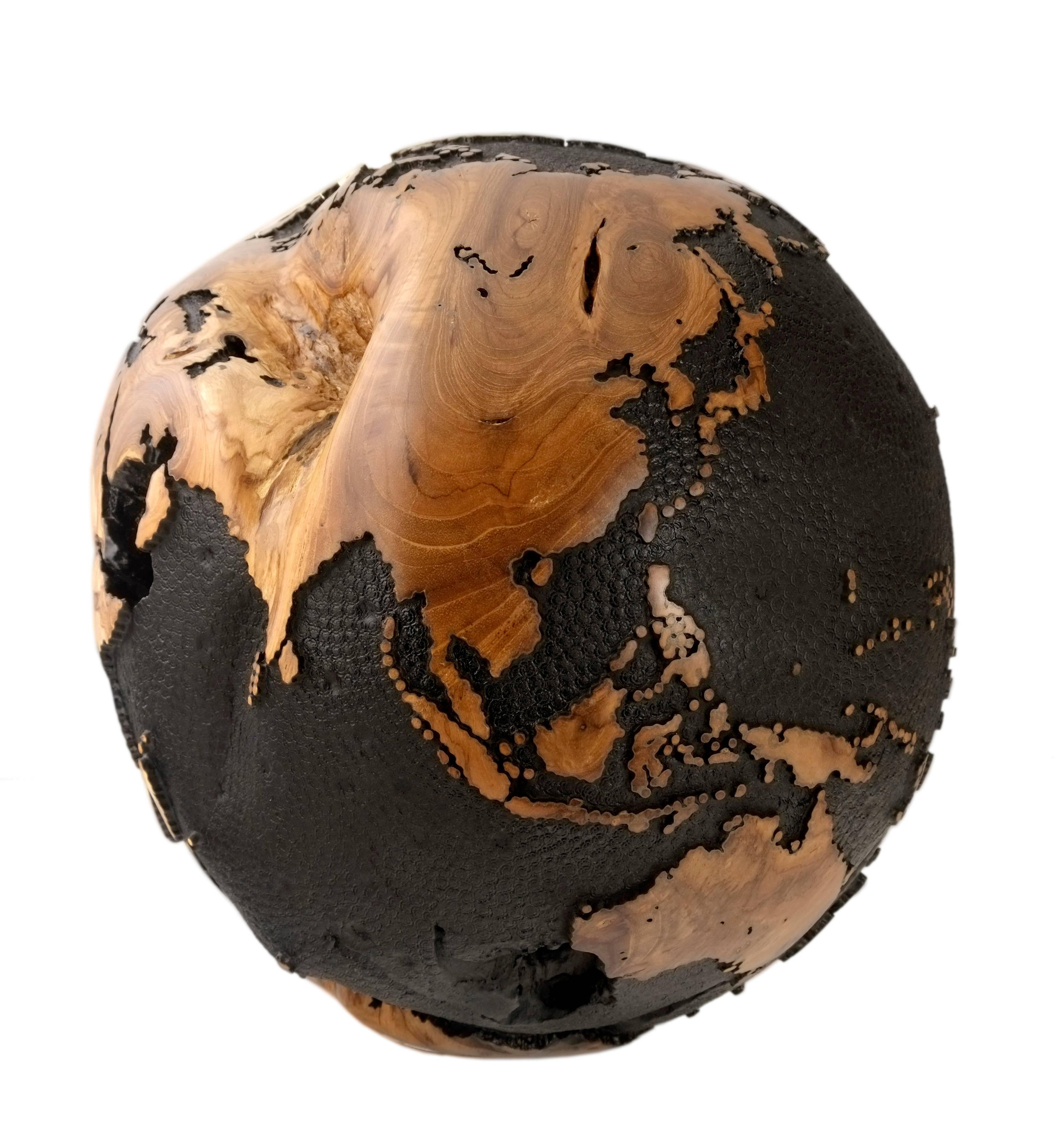 Every room needs a touch of black.

Superb black, hand-carved wooden globe made of teak root with cold iron layer and black paint, round hammered finishing. 

Dimension: 11.81 inches / 30 cm
Materials: Reclaimed teak root, cold iron layer,
