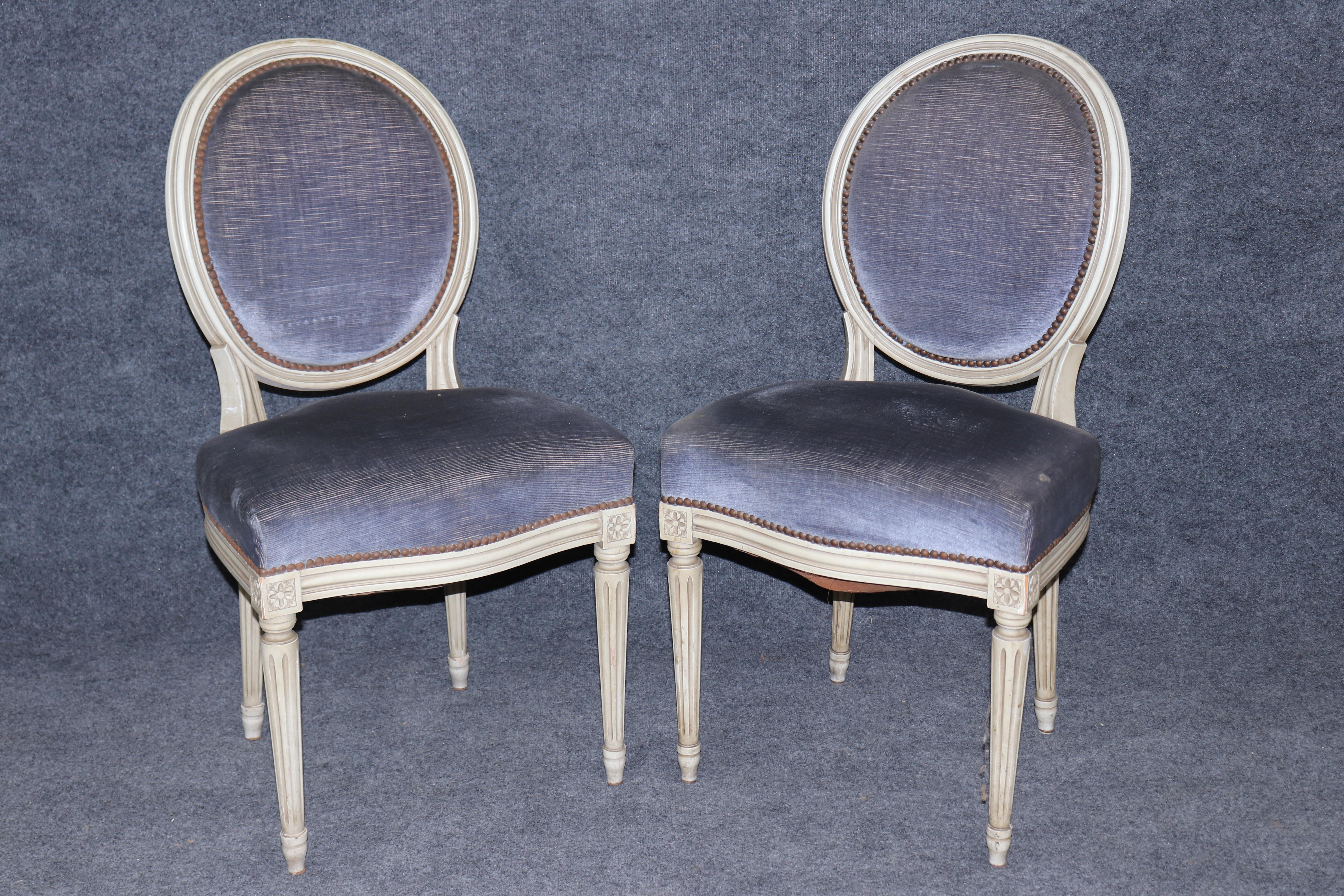 This is an absolutely gorgeous set of French-made chairs in a grayish off-white with a pale blue velvet upholstery that just really makes these chairs a statement. The chairs are French-made and in good condition with normal signs of age and patina
