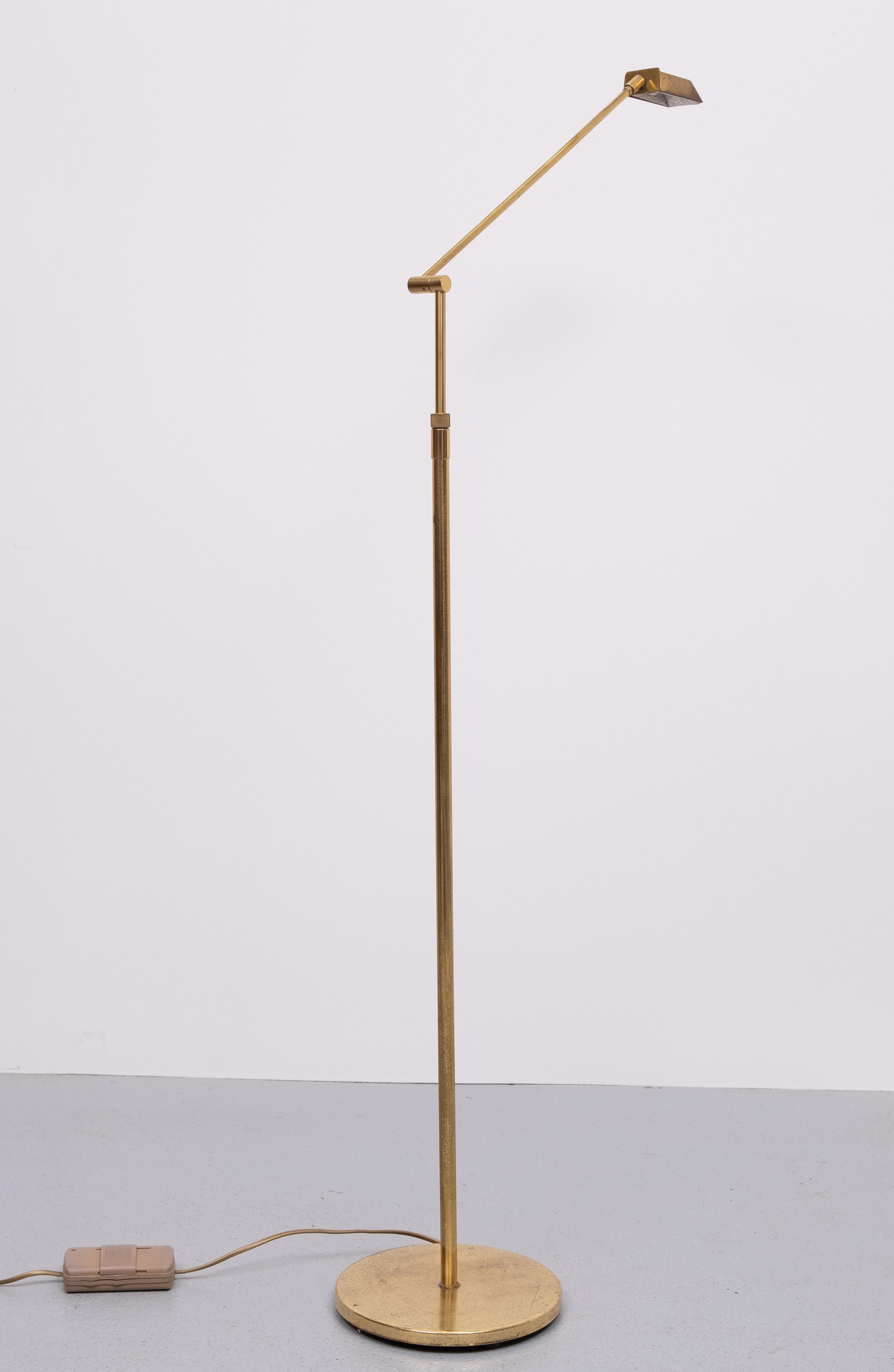 Brass floor lamp, adjustable in height . Perfect in proportions, love this small elegant shade  comes with just the right amount of patine .Believe me this is the nicest one I ever had . Halogen comes with a good working dimmer . 