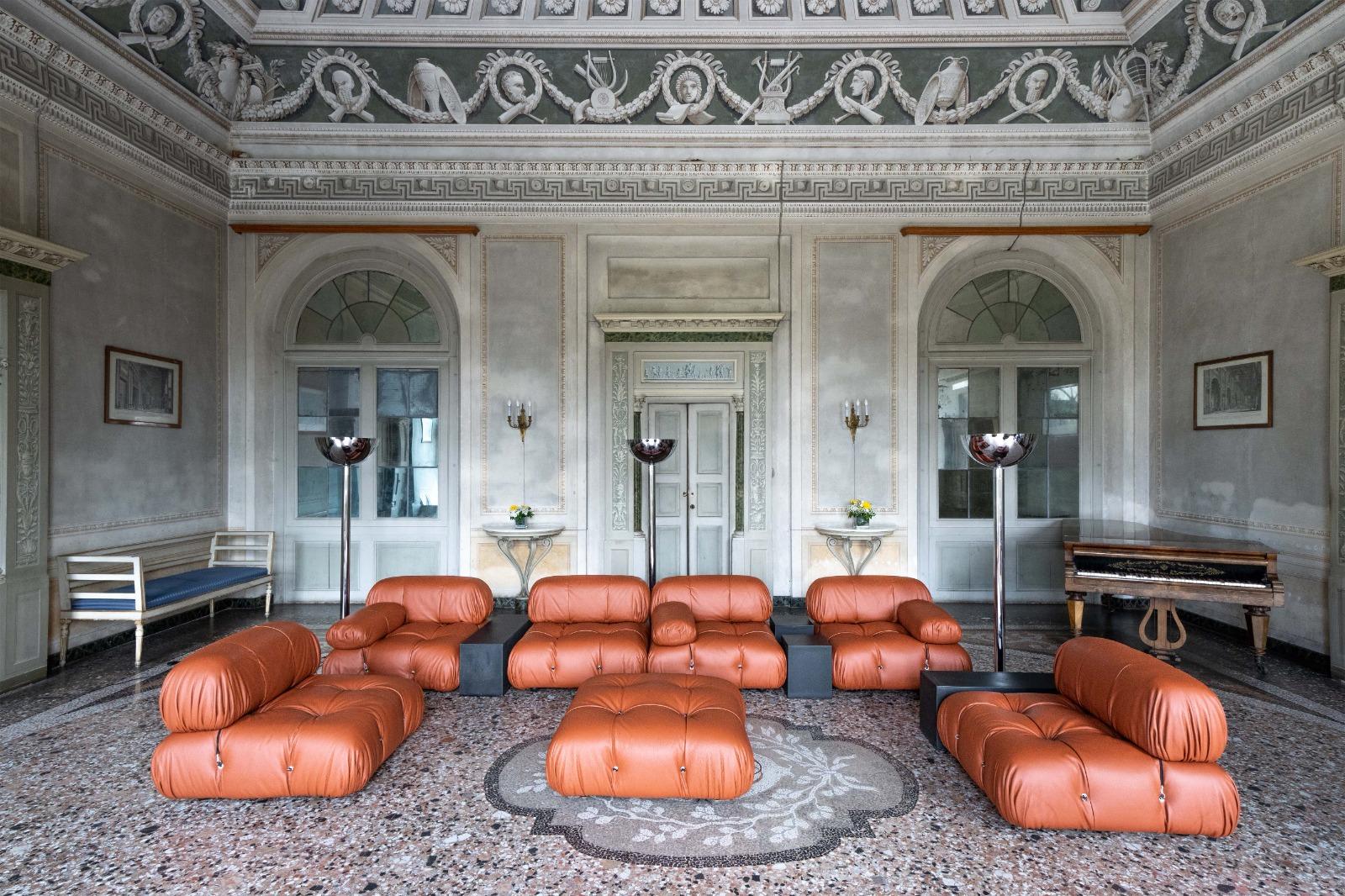A masterpiece, this first edition Mario Bellini Camaleonda modular sofa, in cognac leather upholstery. Produced in the early 70s by C&B Italia, Italy. 7 large seating elements, with back and armrests. Combined with 3 Gli Scacchi Side Tables.  All