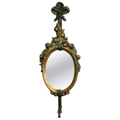 Superb Carved and Painted French Oval Mirror A superb piece hand carved