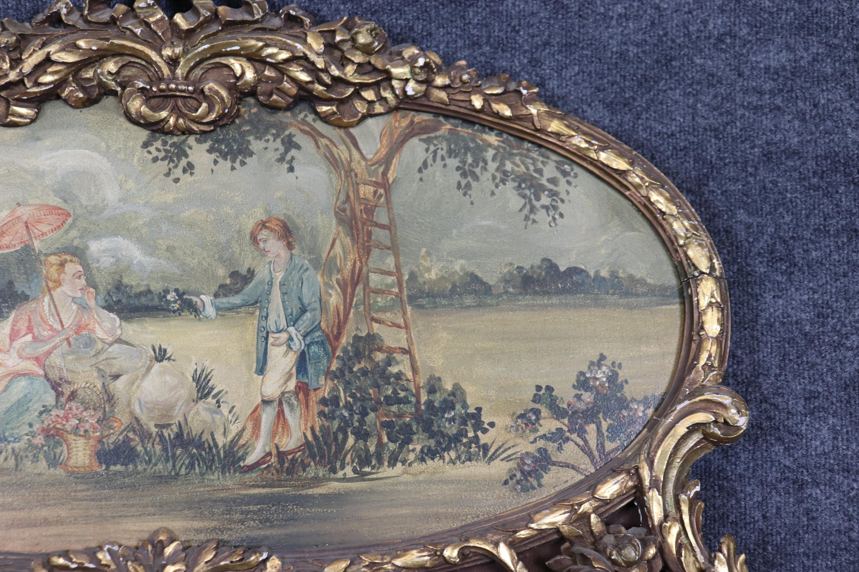 Early 20th Century Superb Carved French Louis XV Giltwood Oil on Board Courtship Painted Scene For Sale