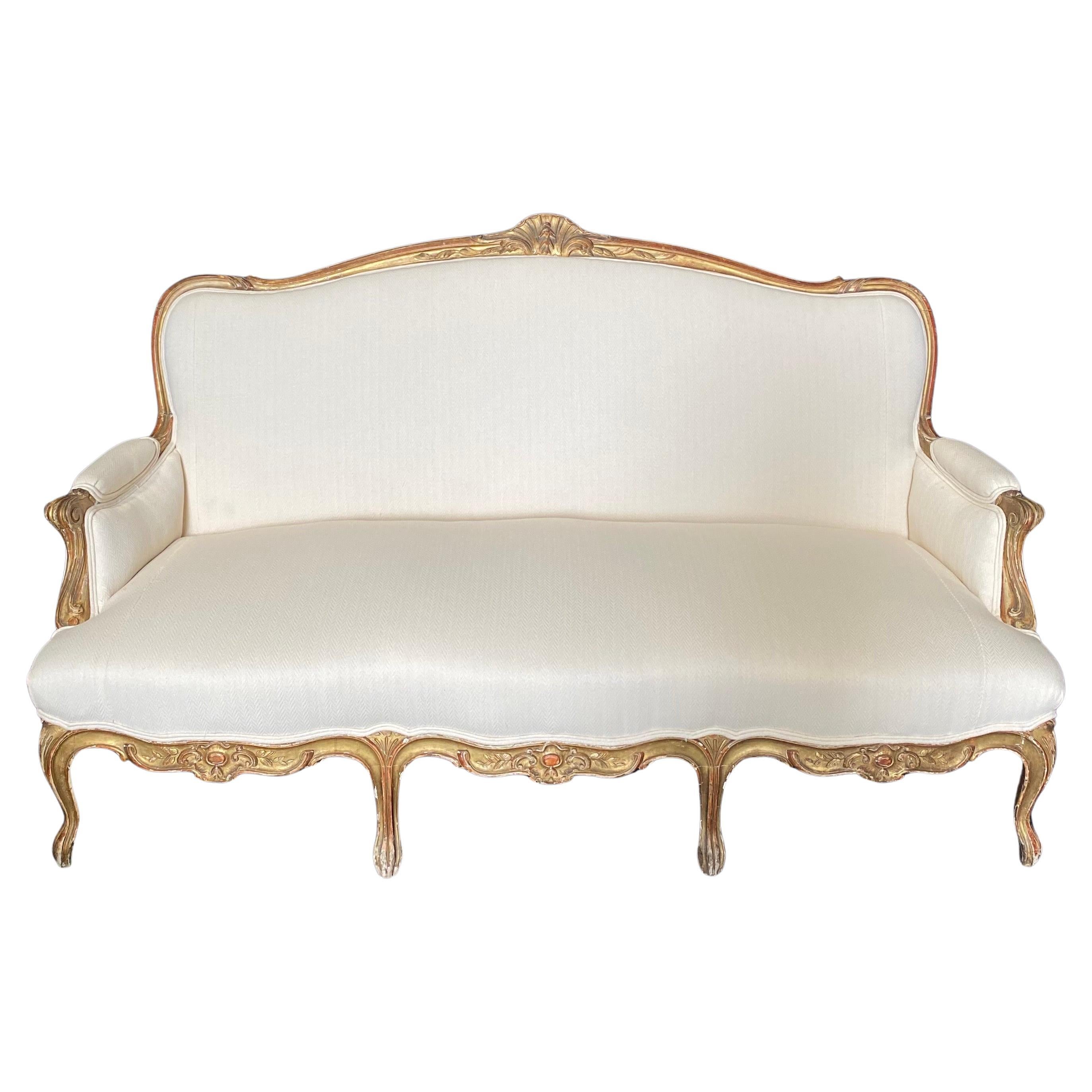 Superbe canapé provençal français Louis XV du 19ème siècle sculpté et doré