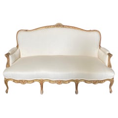 Superbe canapé provençal français Louis XV du 19ème siècle sculpté et doré
