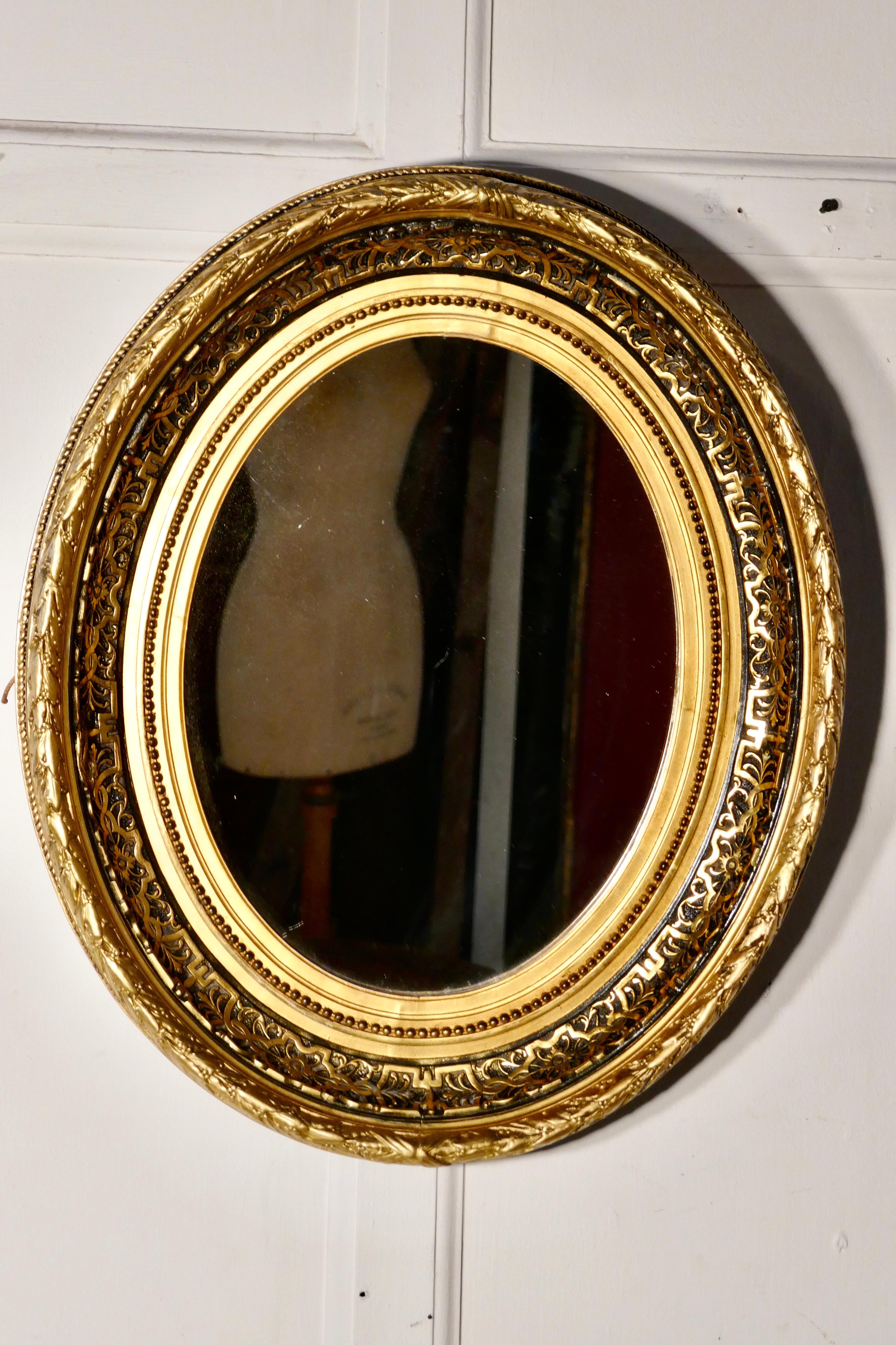 Superb Deep Oval Frame French Empire Gilt and Lacquer Wall Mirror In Good Condition In Chillerton, Isle of Wight