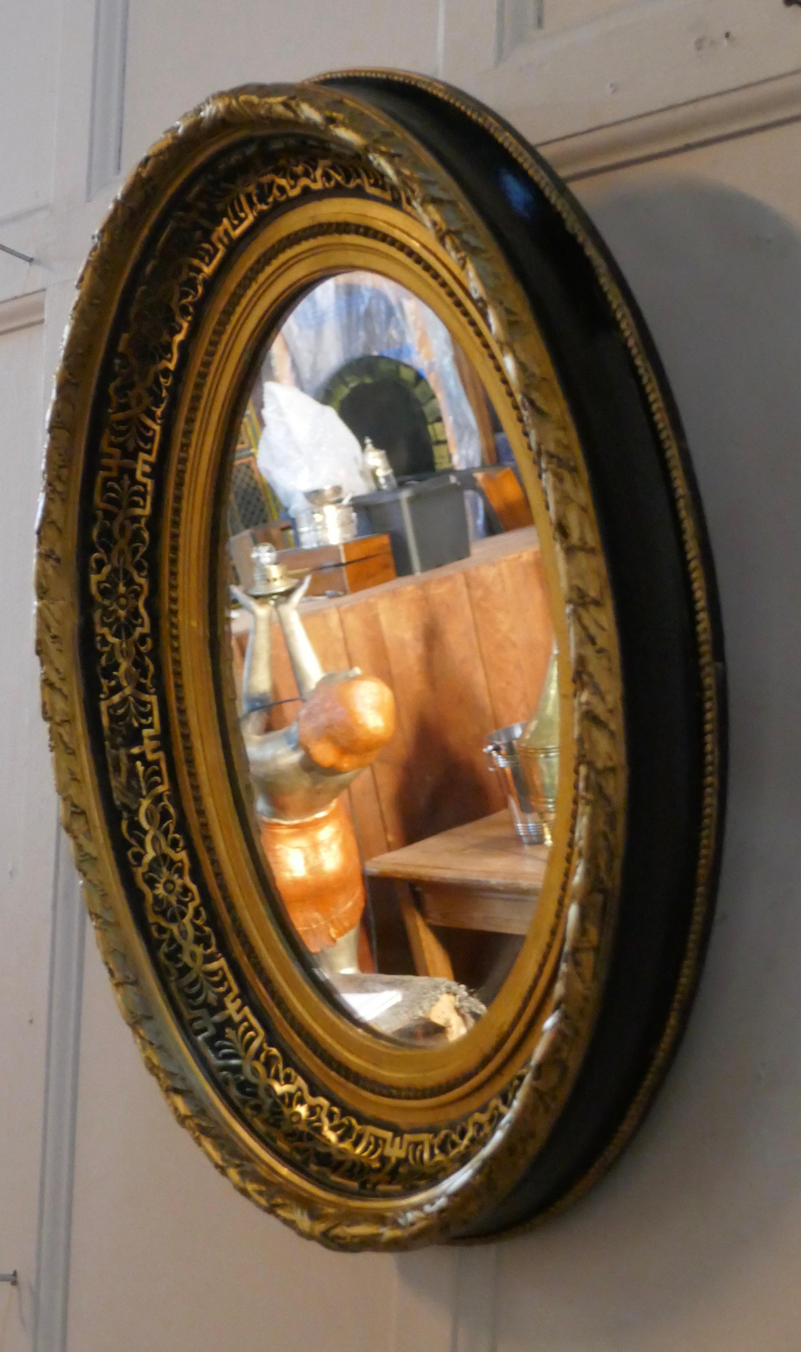 19th Century Superb Deep Oval Frame French Empire Gilt and Lacquer Wall Mirror