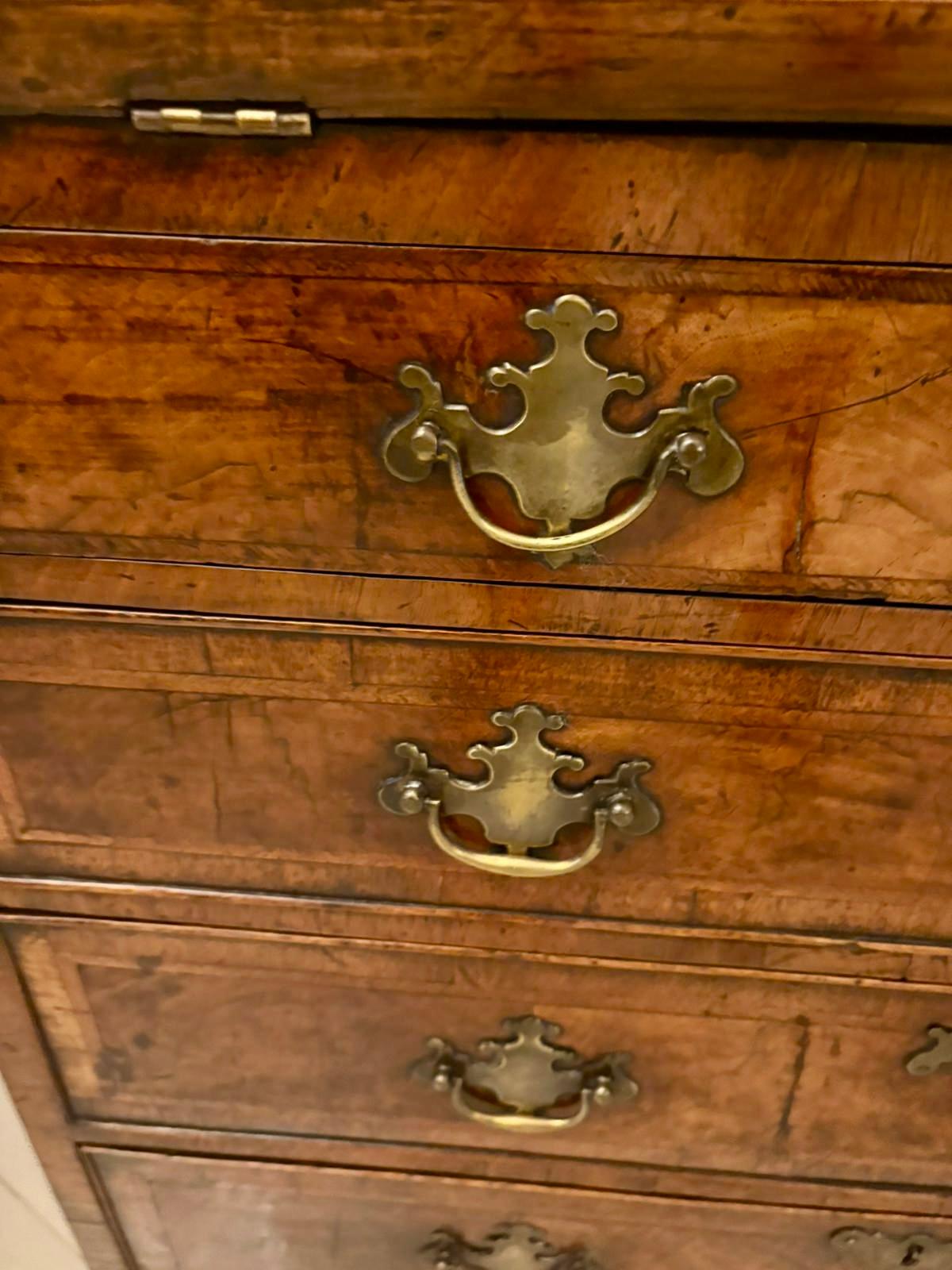 A fine superb quality early 18th-century George I period walnut bureau of compact proportions beautifully made and displaying excellent colour and patination. The fall-front opens to reveal a well-fitted interior with small drawers, pigeonholes and