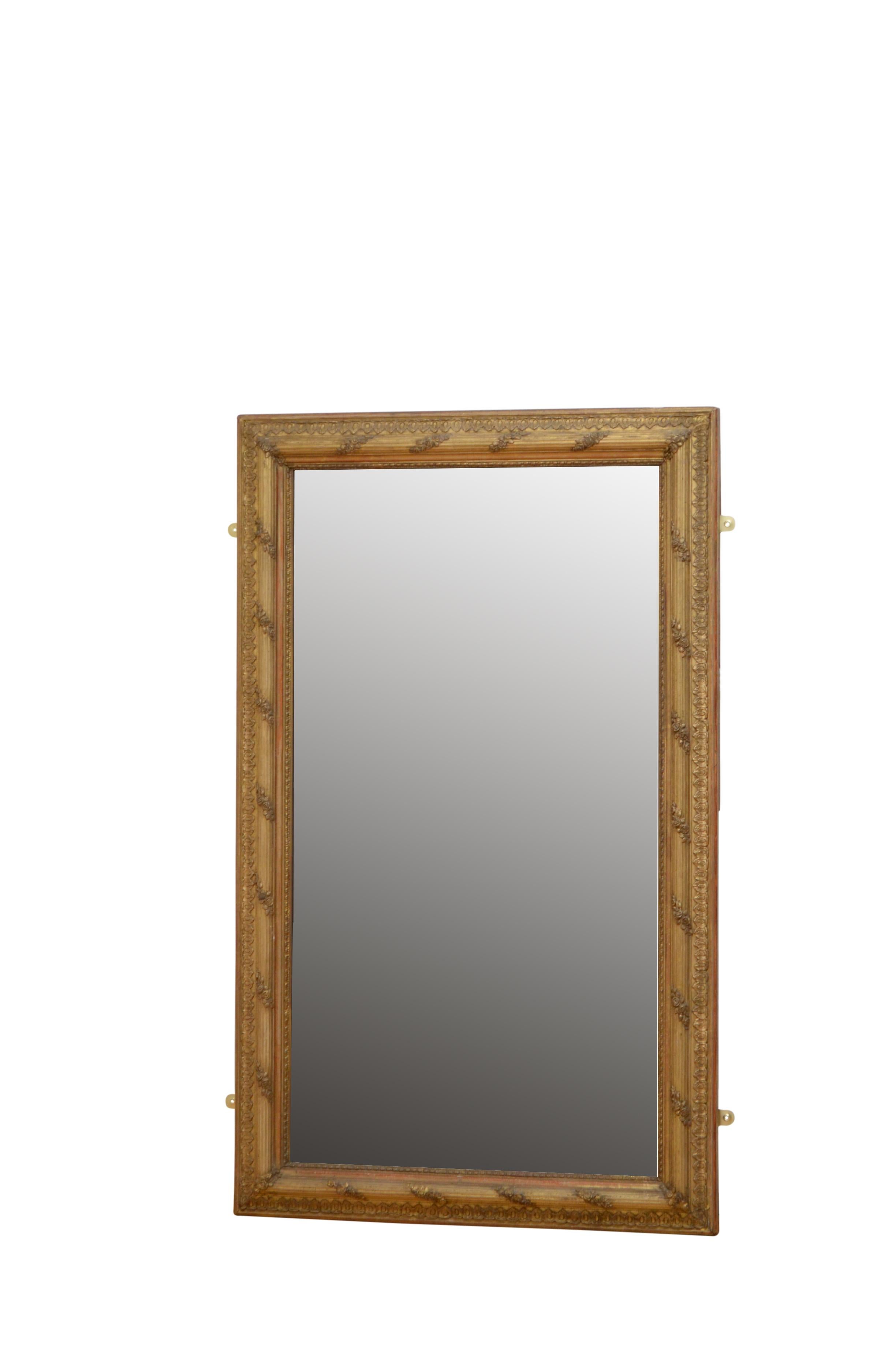 Superb gilded wall mirror or pier mirror, having original mercury glass in moulded and reeded frame with floral decoration throughout. This antique mirror can be positioned vertically or horizontally, it retains its original glass, gilt and