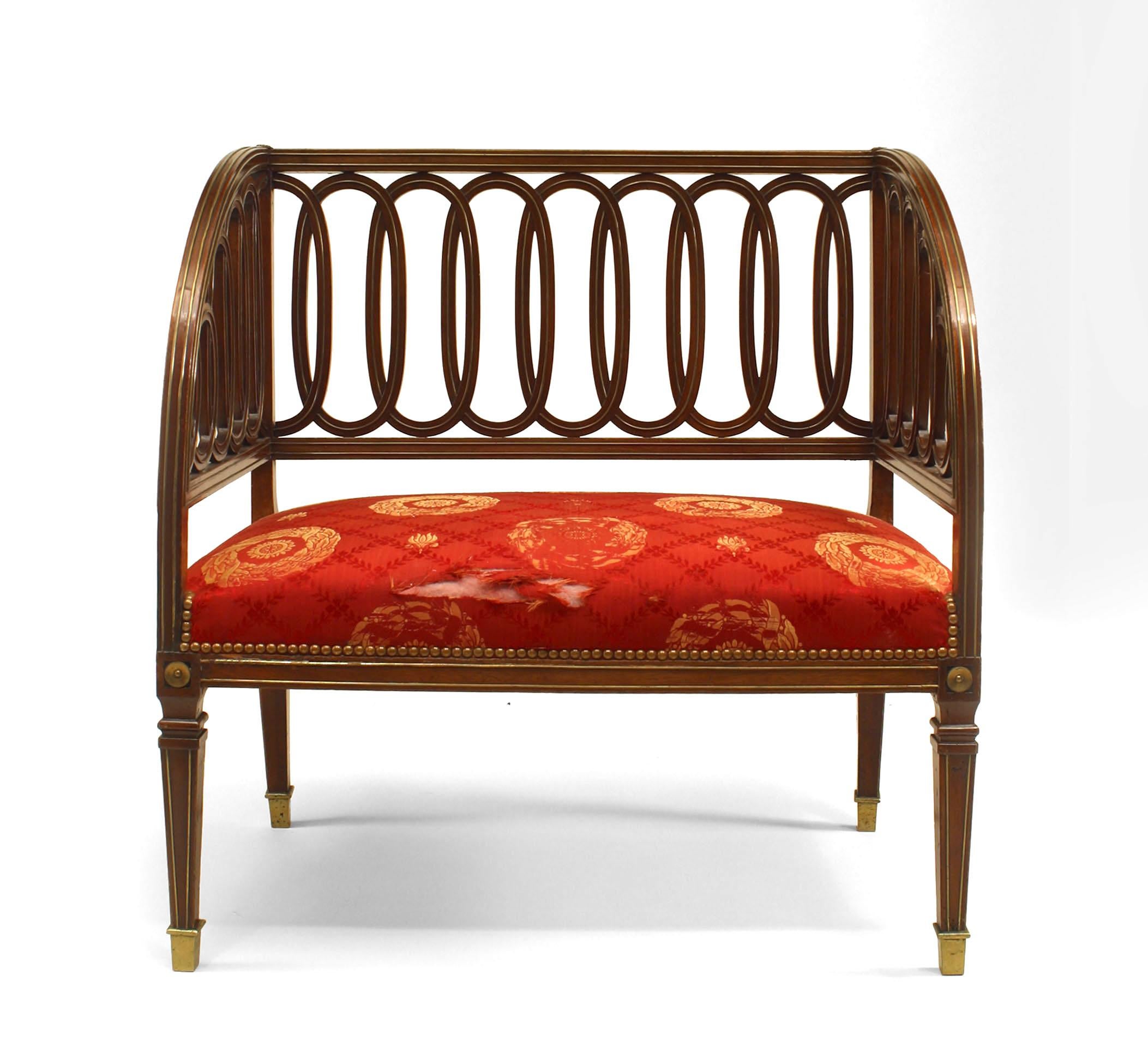 19th century Russian neoclassic small brass-mounted mahogany bench having an unusual interlocking pierced oval design to back and sides supported by tapered legs, the whole decorated with inset brass.