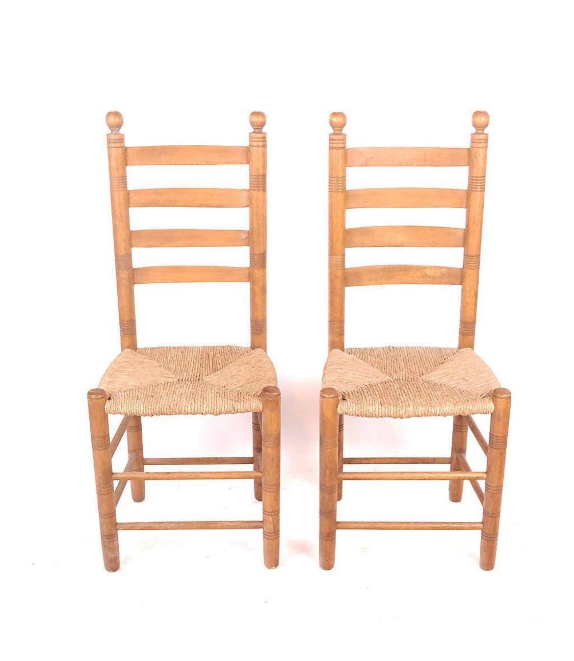 Beautiful set of 8 Early American Shaker style chairs. All chairs match with a high ladder back design with ball tops. Hand crafted details using primitive yet masterful techniques. Rush seats have varying patina but all in good condition. Great in