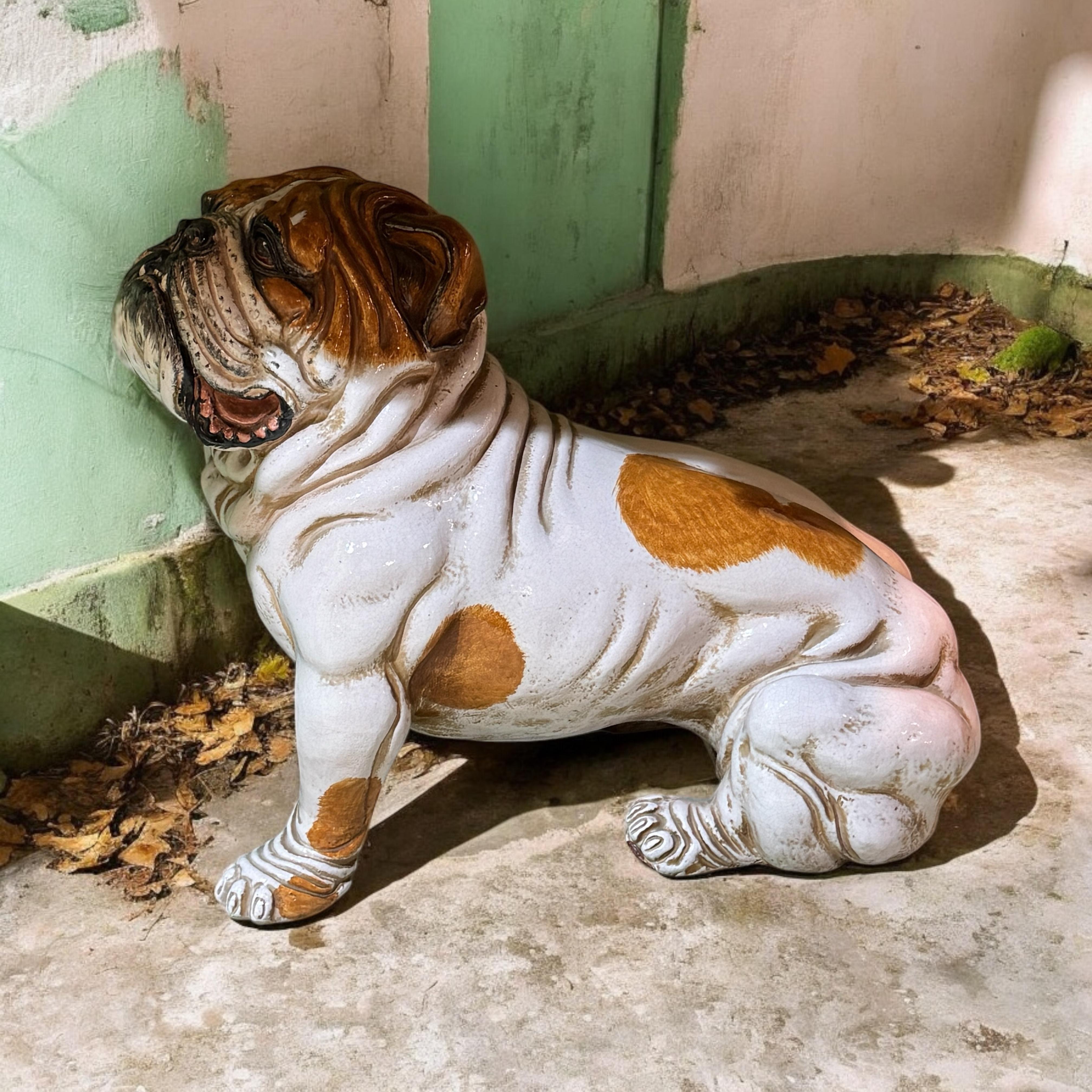 Add a touch of charm to your home with this exquisite ceramic Terracotta English Bulldog sculpture. This piece captures the playful spirit of the beloved breed with intricate detailing and a warm, rustic finish. Perfect for displaying on a hall