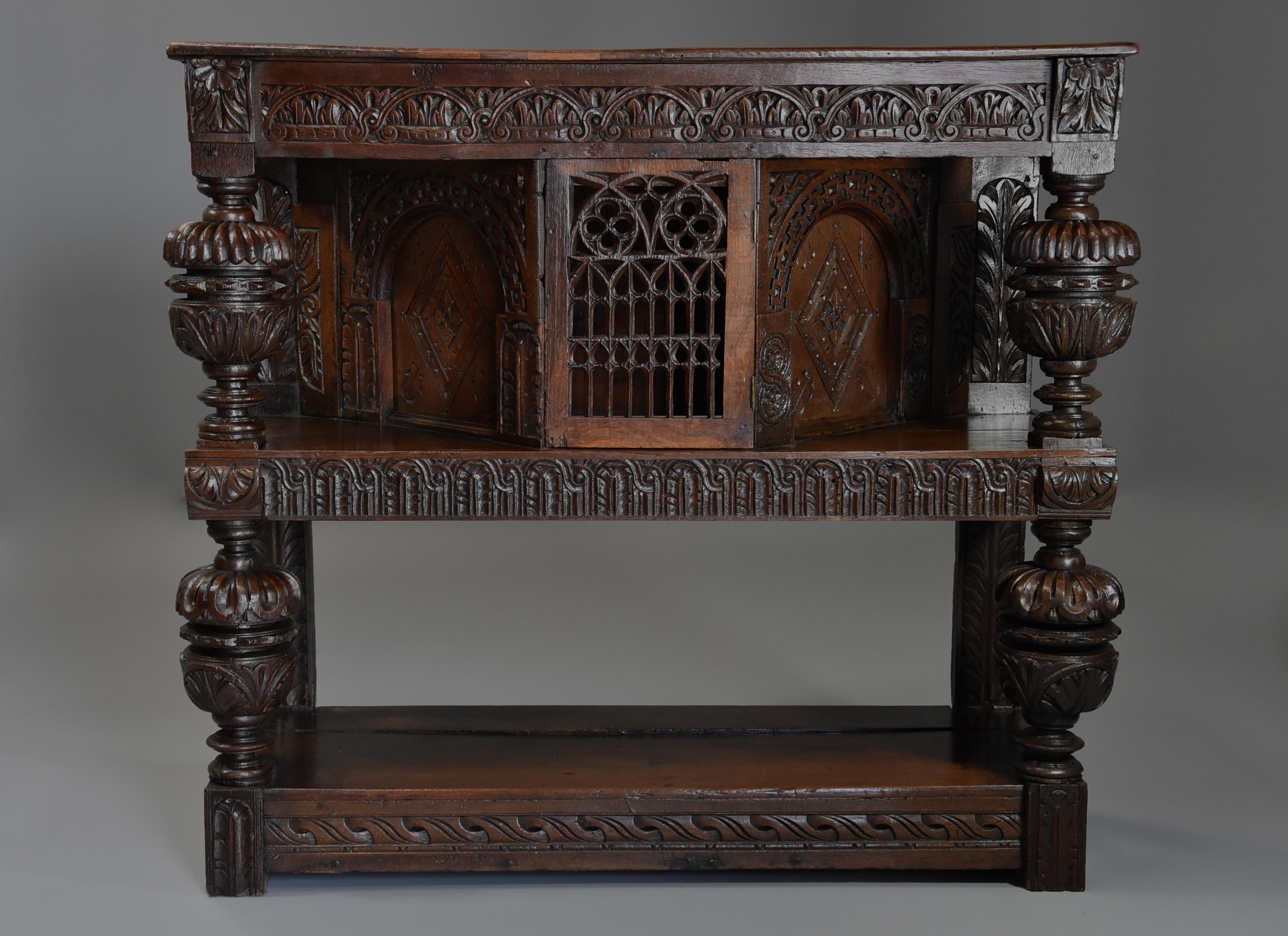 A superb oak livery cupboard constructed in the Victorian period of mainly 17th century carved pieces, the cupboard of very good proportions and of wonderful patina (colour).

This livery cupboard consists of a two plank top with some old