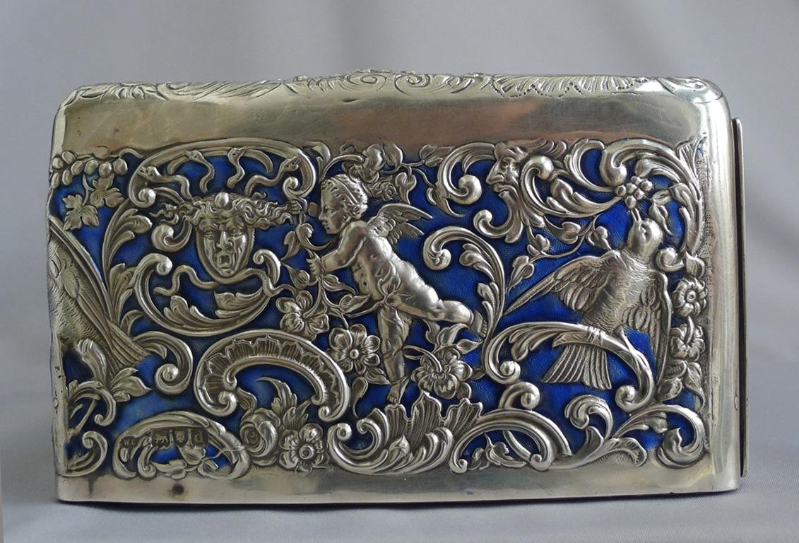 An extremely fine silver and enamel casket by the pre-eminent London Silversmith of the late 19th, early twentieth century, William Comyns. The casket or box, of very good size, with a pull out draw with handle, lined with blue satin. The box is