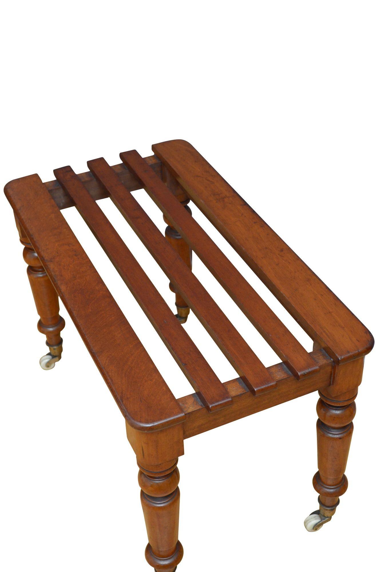 P0292 Fine quality and very unusual Victorian solid mahogany luggage rack, having slatted top and shallow frieze, all standing on four turned legs terminating in original brass cup castors with white ceramic wheels with 'the patent CB & L'. This
