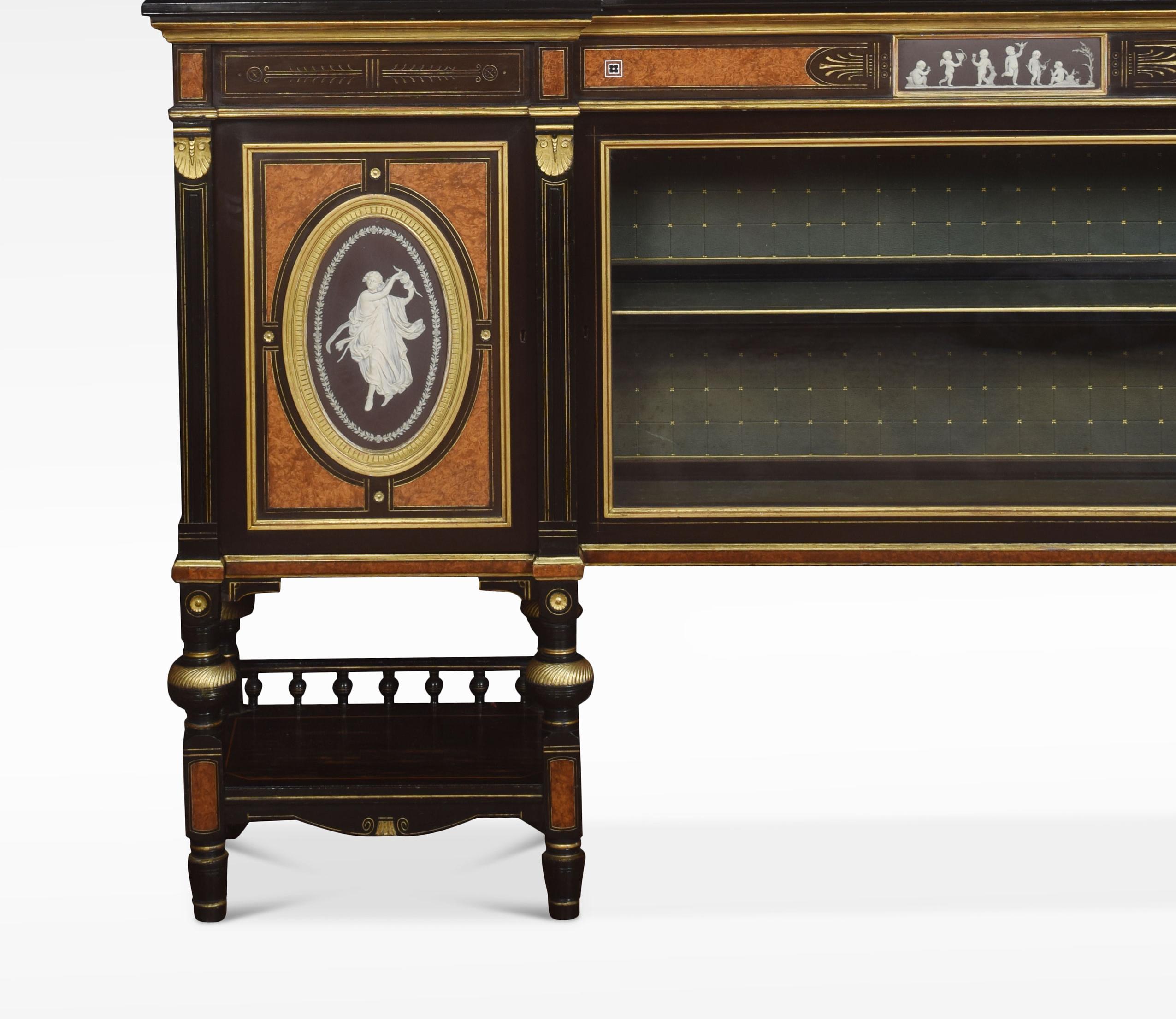 Superb exhibition quality 19th century English cabinet by Lamb of Manchester, the raised pierced brass gallery above large rectangular coromandel top and ebonized edge. To the freeze with gilded detail and central cameo. The base section is fitted