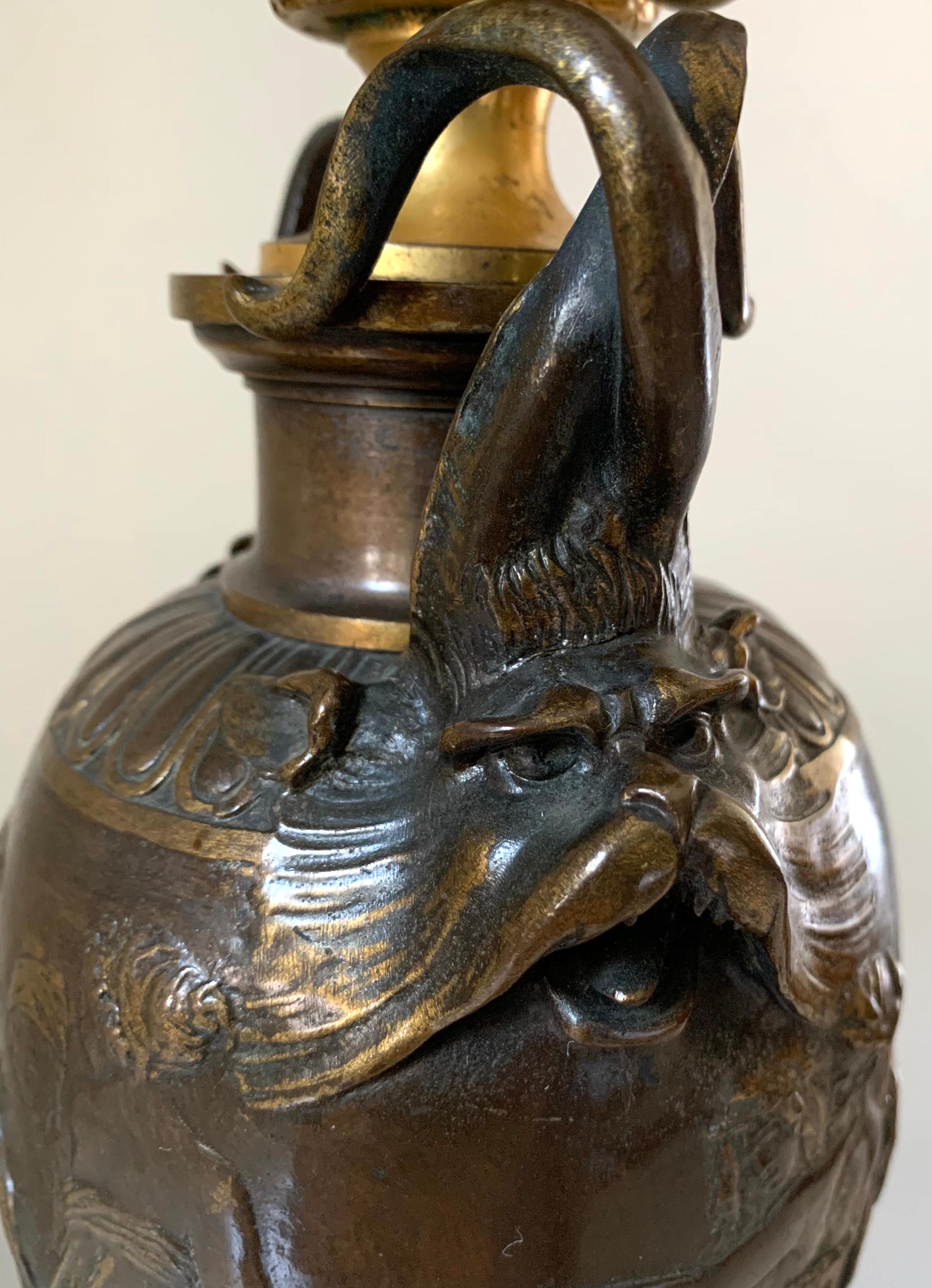 fine antique Napoleon III period signed F. Barbidienne gilt and patinated bronze, carved slate four light lamp with mythological creatures and classical Grecian maidens.
circa 1870
Centered by a superb quality patinated bronze vase with gilded