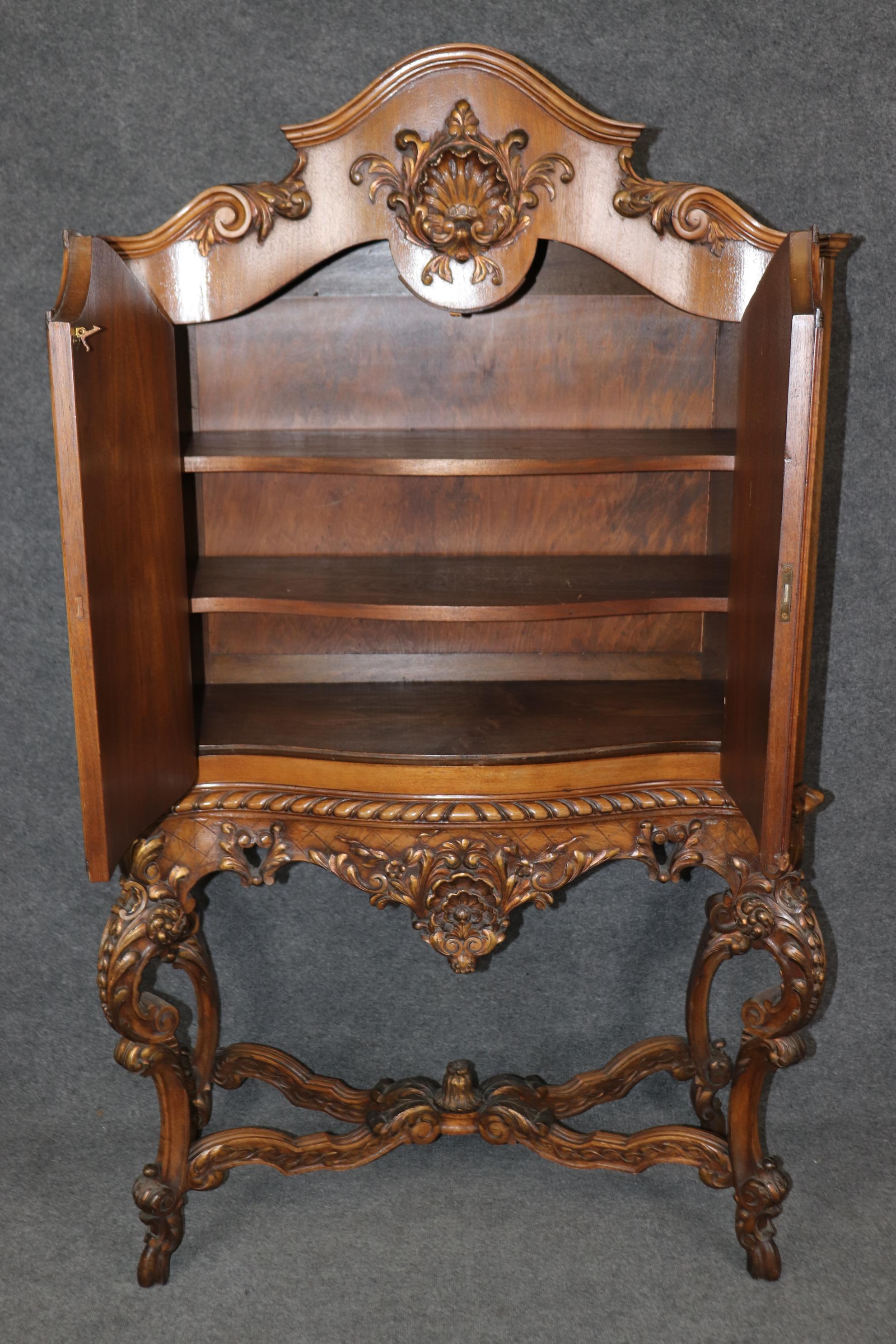 This is a fantastic paint decorated French china cabinet or liquor bar. The cabinet is painted with gorgeous delicately painted figures and extraordinary carving. The cabinet is in good antique condition with normal age-related signs of use and wear